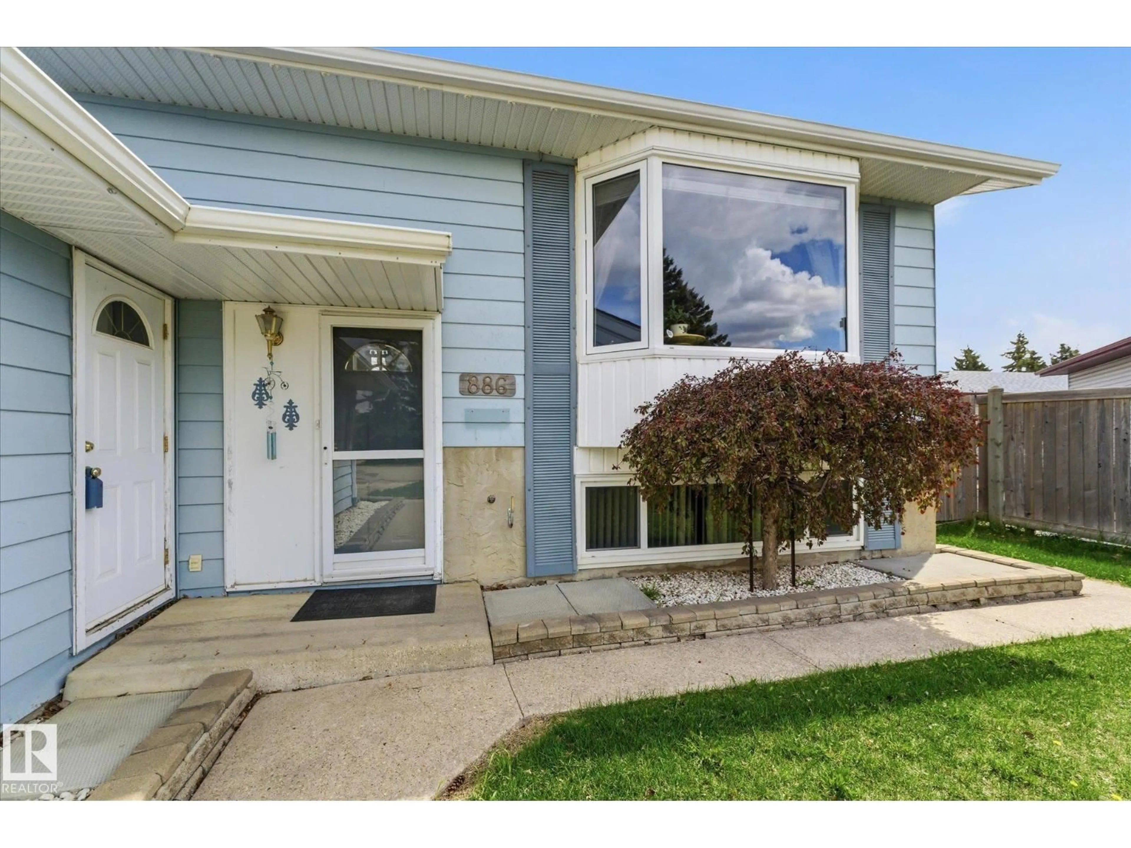 Home with vinyl exterior material, street for 886 KNOTTWOOD RD, Edmonton Alberta T6K3C3