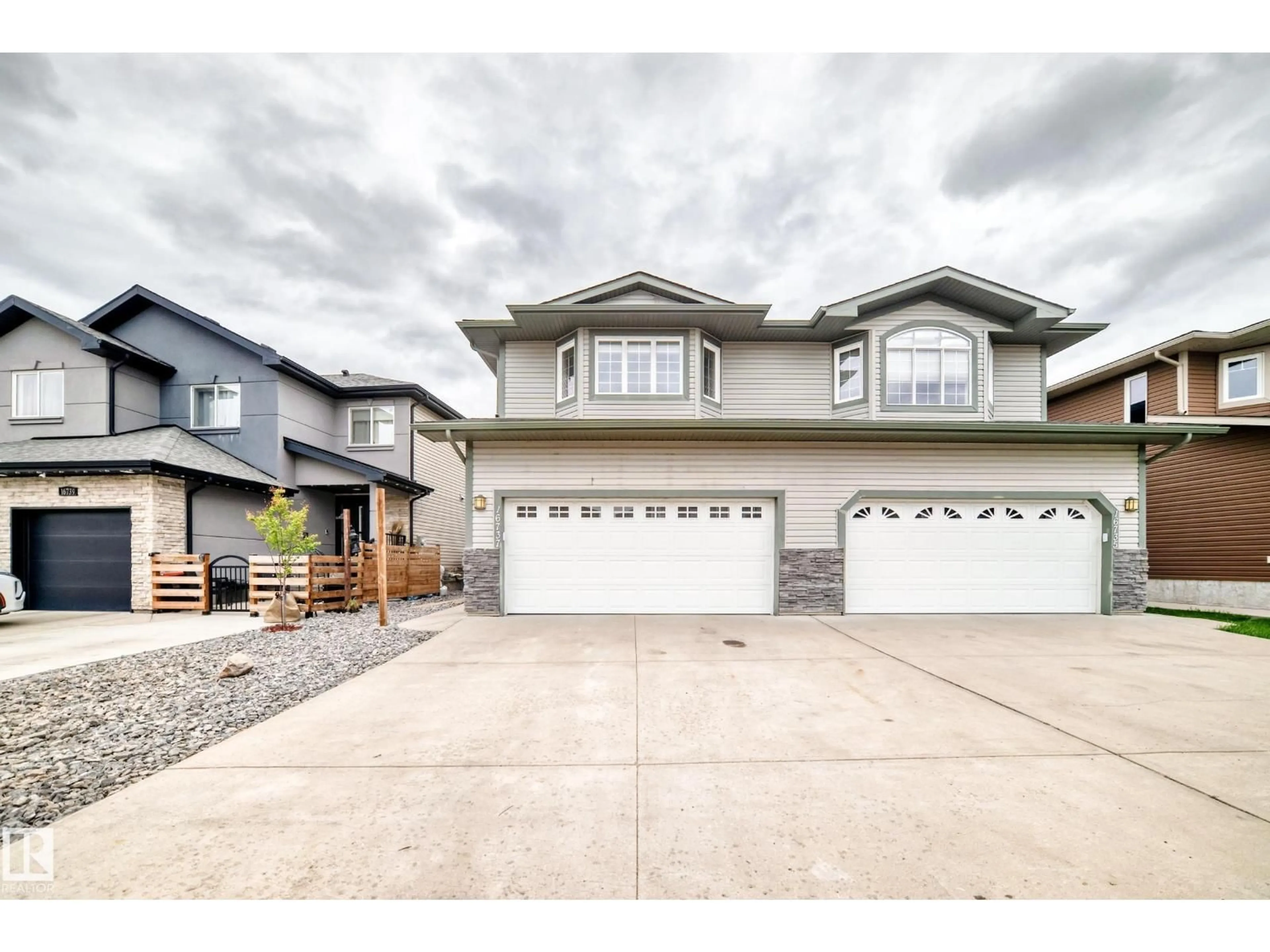 Home with vinyl exterior material, street for 16737 60ST NW, Edmonton Alberta T5Y0W5