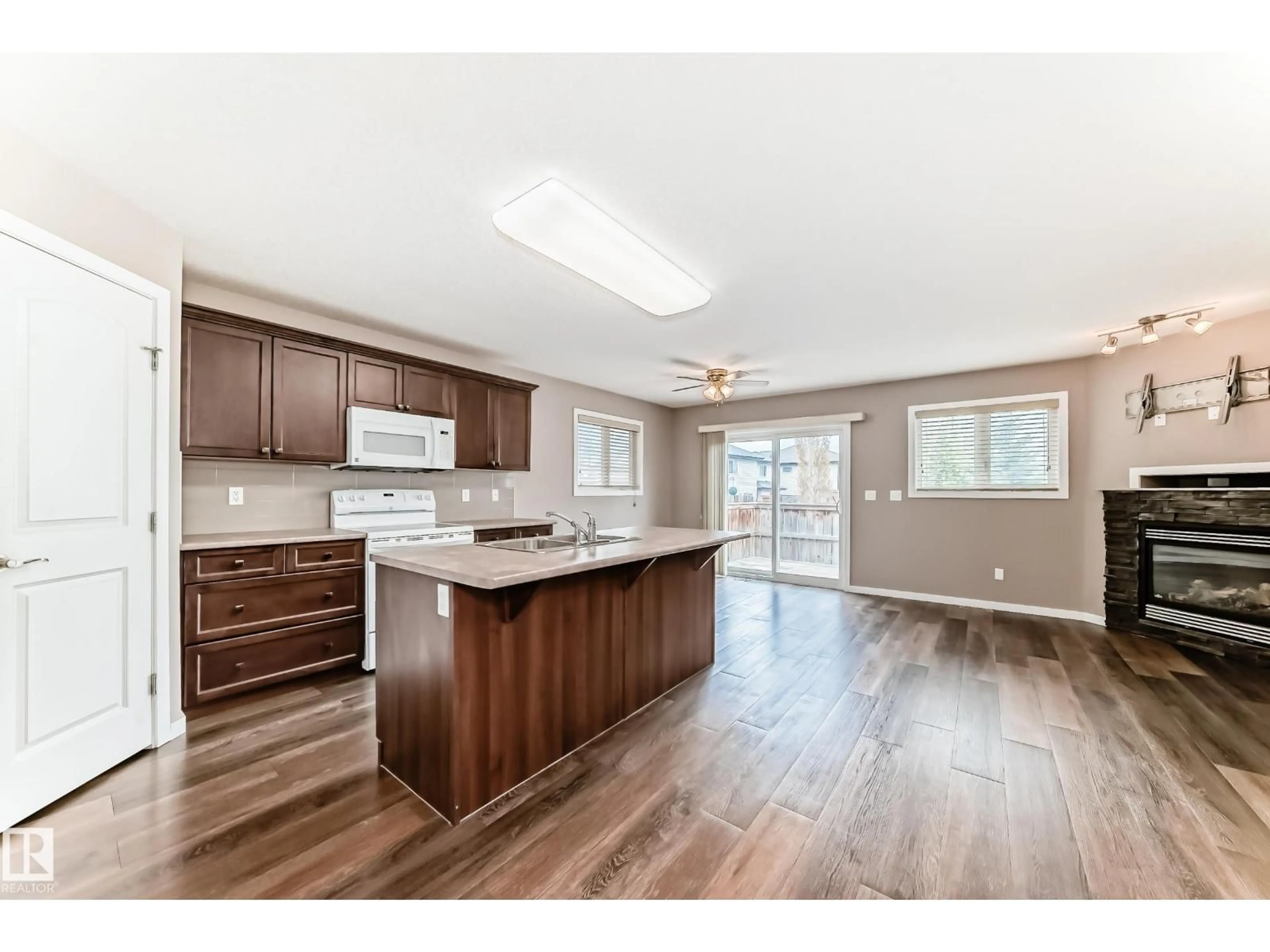 Open concept kitchen, wood/laminate floor for 16737 60ST NW, Edmonton Alberta T5Y0W5