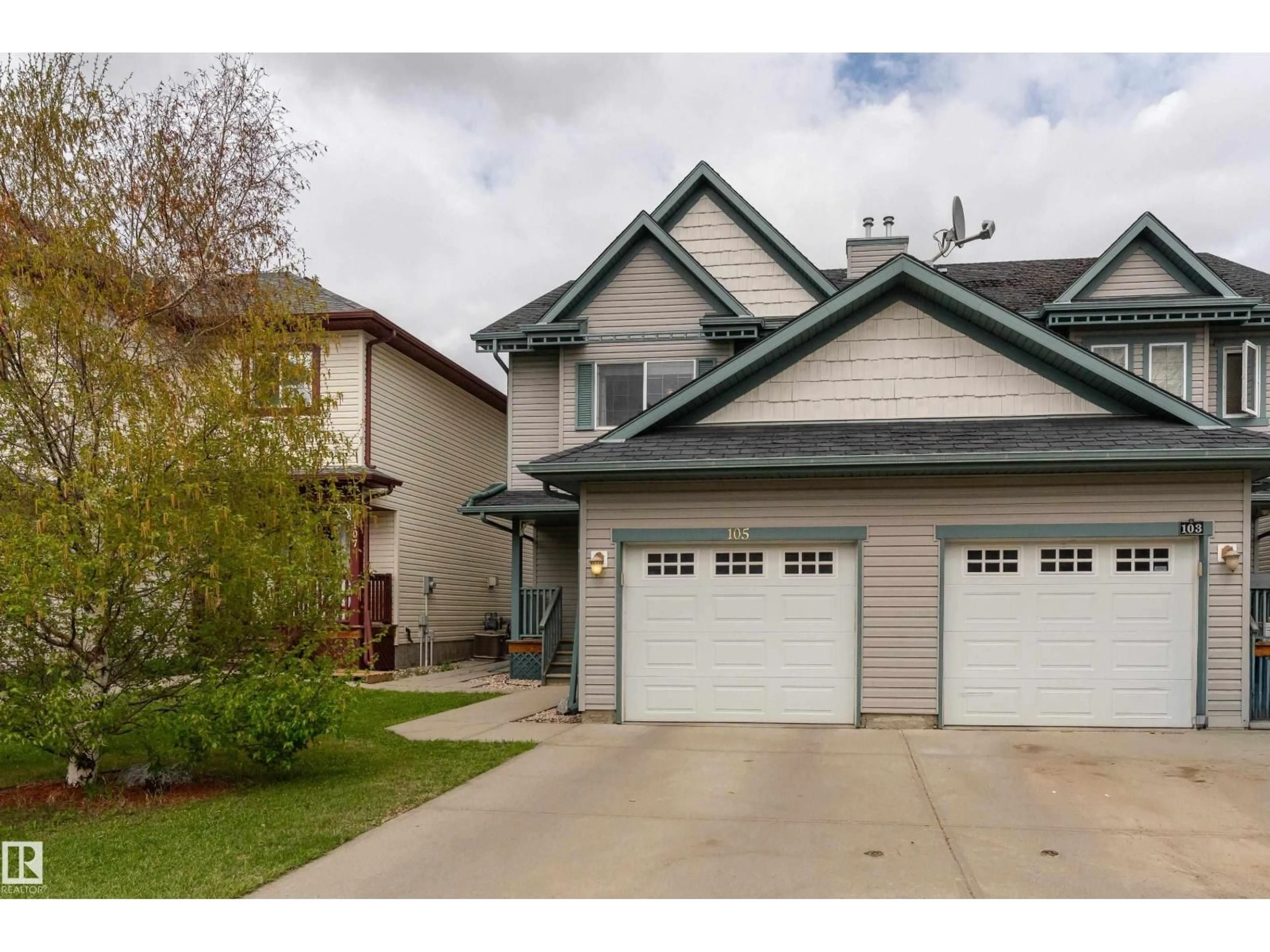 Home with vinyl exterior material, street for 105 GALLOWAY WD, Fort Saskatchewan Alberta T8L0A7
