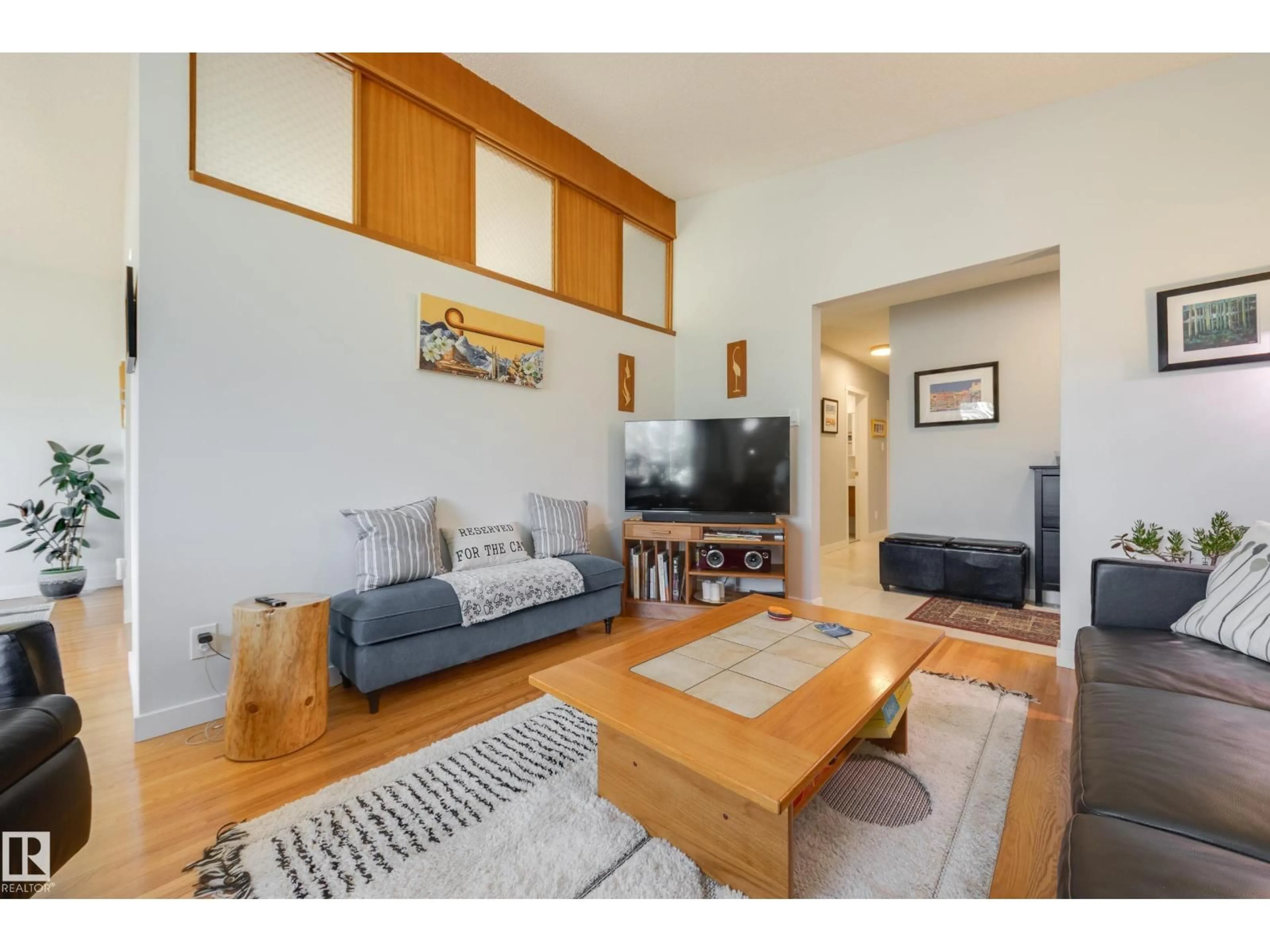 Living room with furniture, wood/laminate floor for 7211 90 AV, Edmonton Alberta T6B0P5