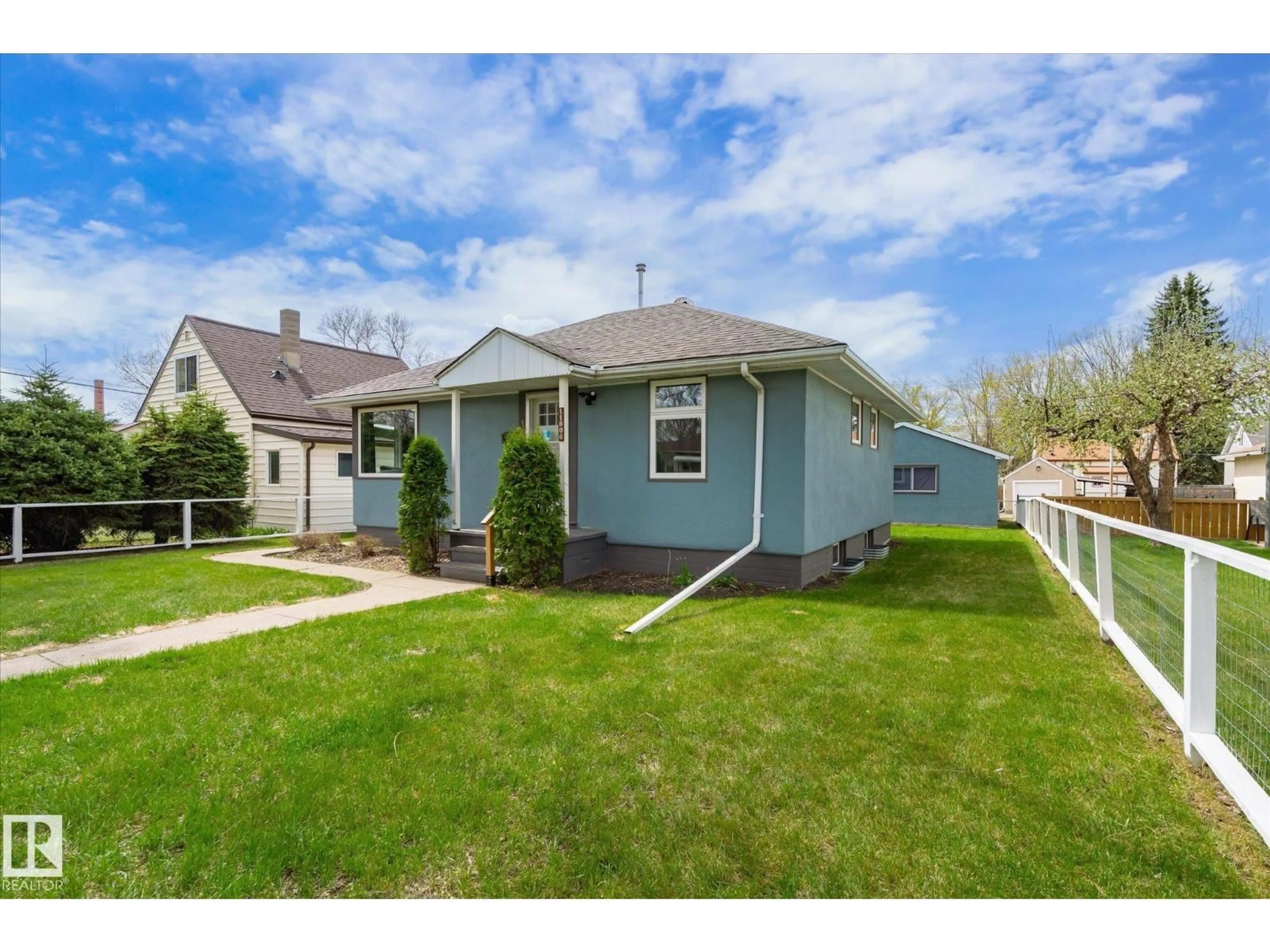 Home with vinyl exterior material, street for 11606 68 ST, Edmonton Alberta T5B1P3