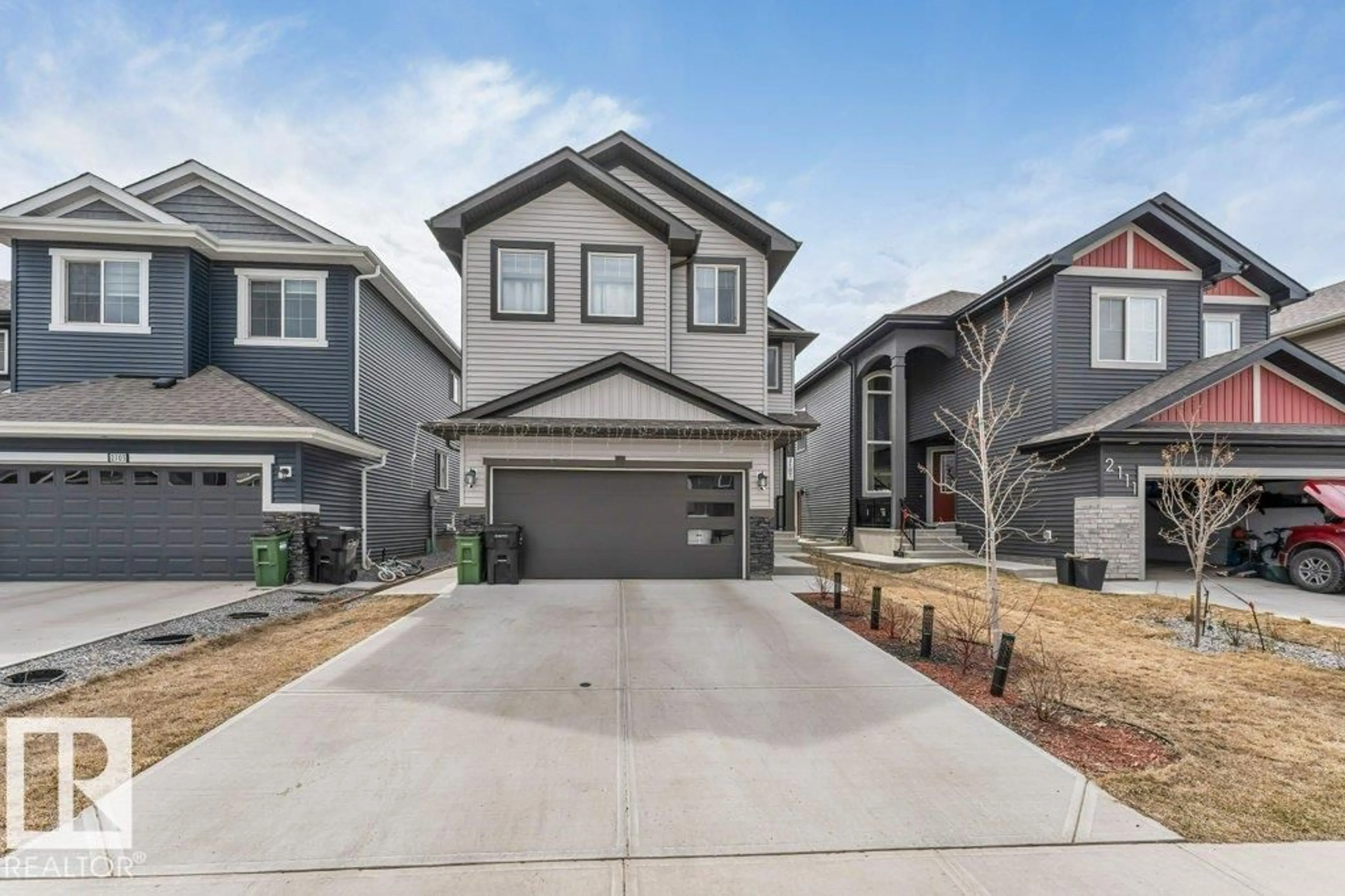 Home with vinyl exterior material, street for 2107 14 AV, Edmonton Alberta T6T2R6