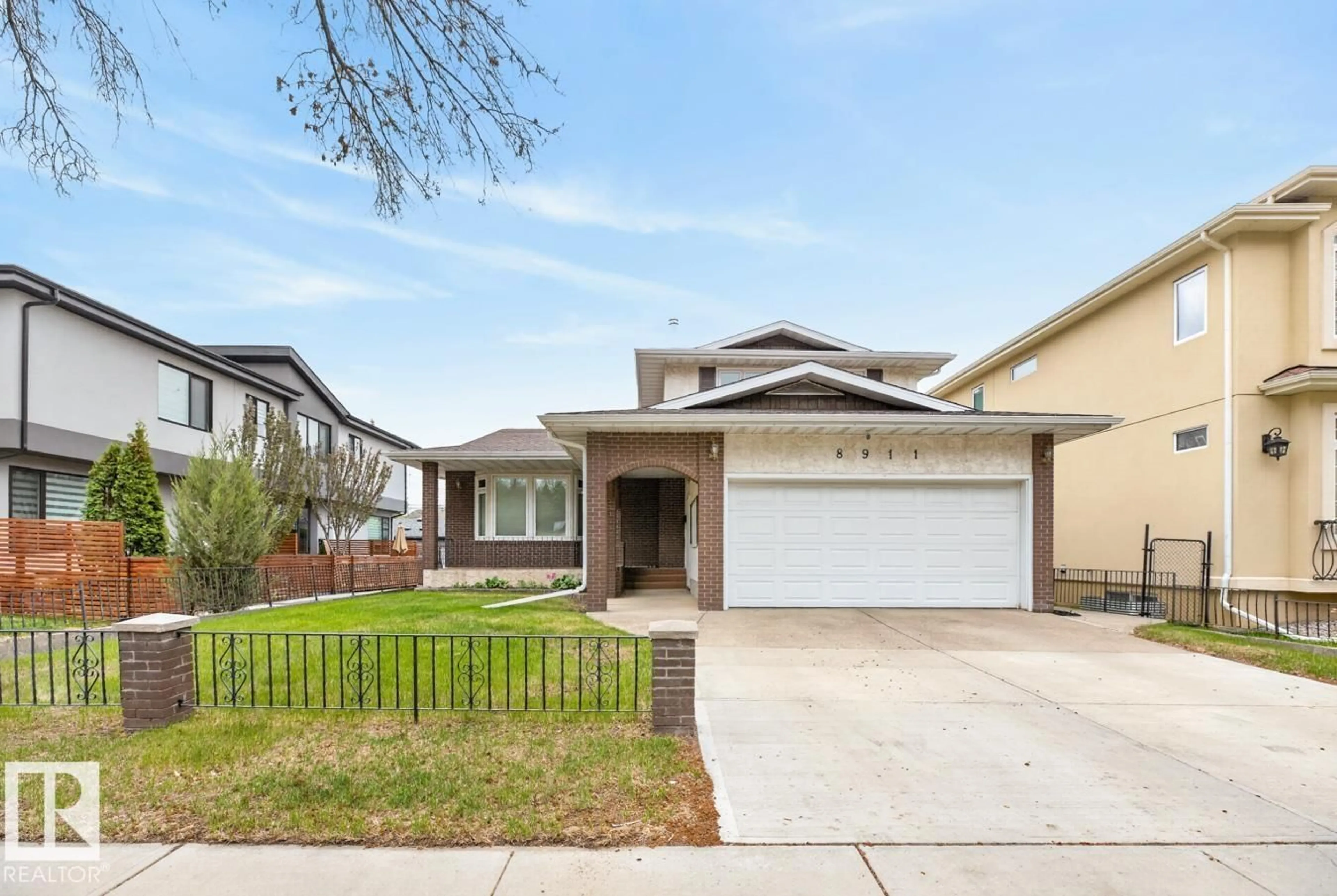 Home with vinyl exterior material, street for 8911 84 AV, Edmonton Alberta T6C1E3