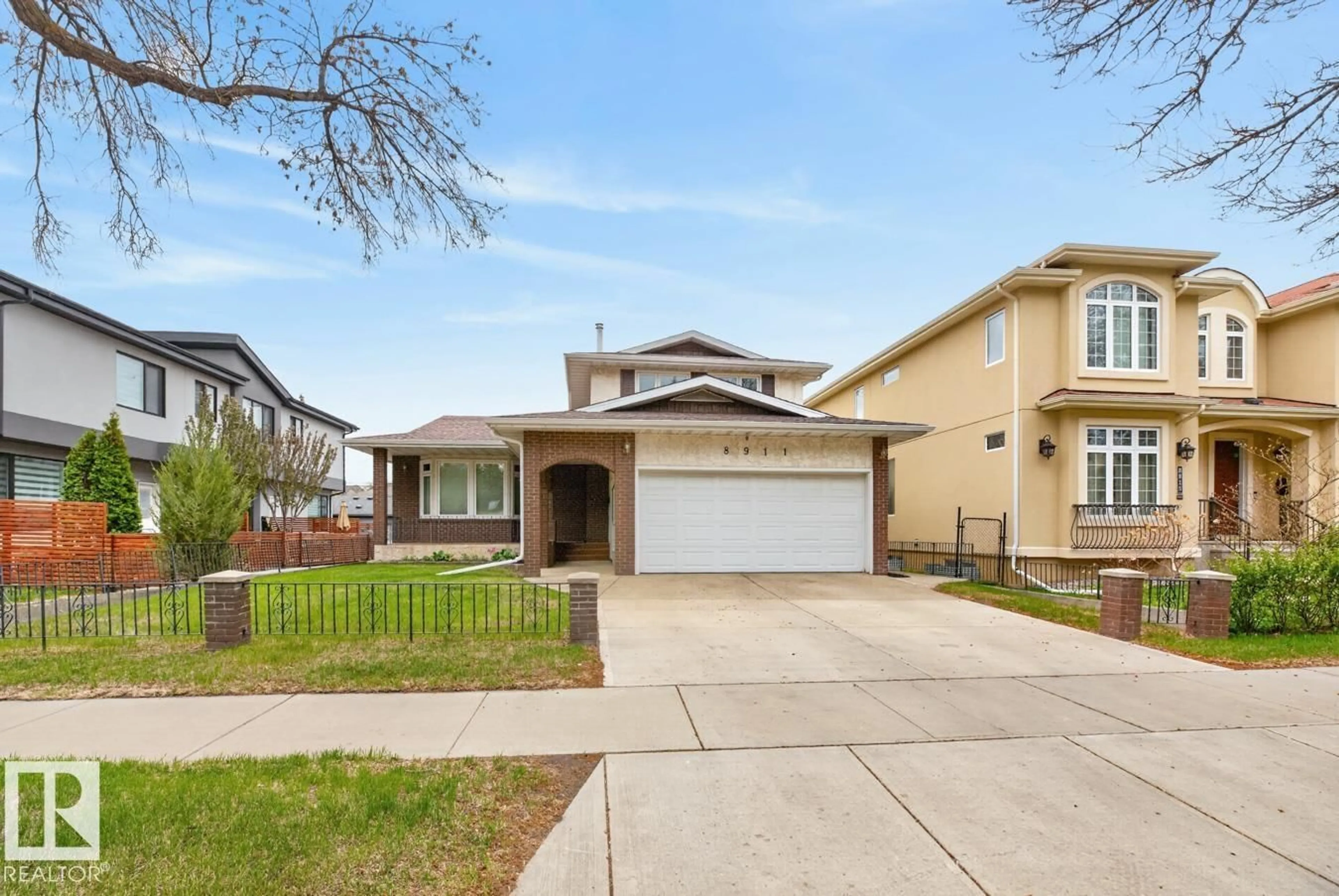 Home with vinyl exterior material, street for 8911 84 AV, Edmonton Alberta T6C1E3