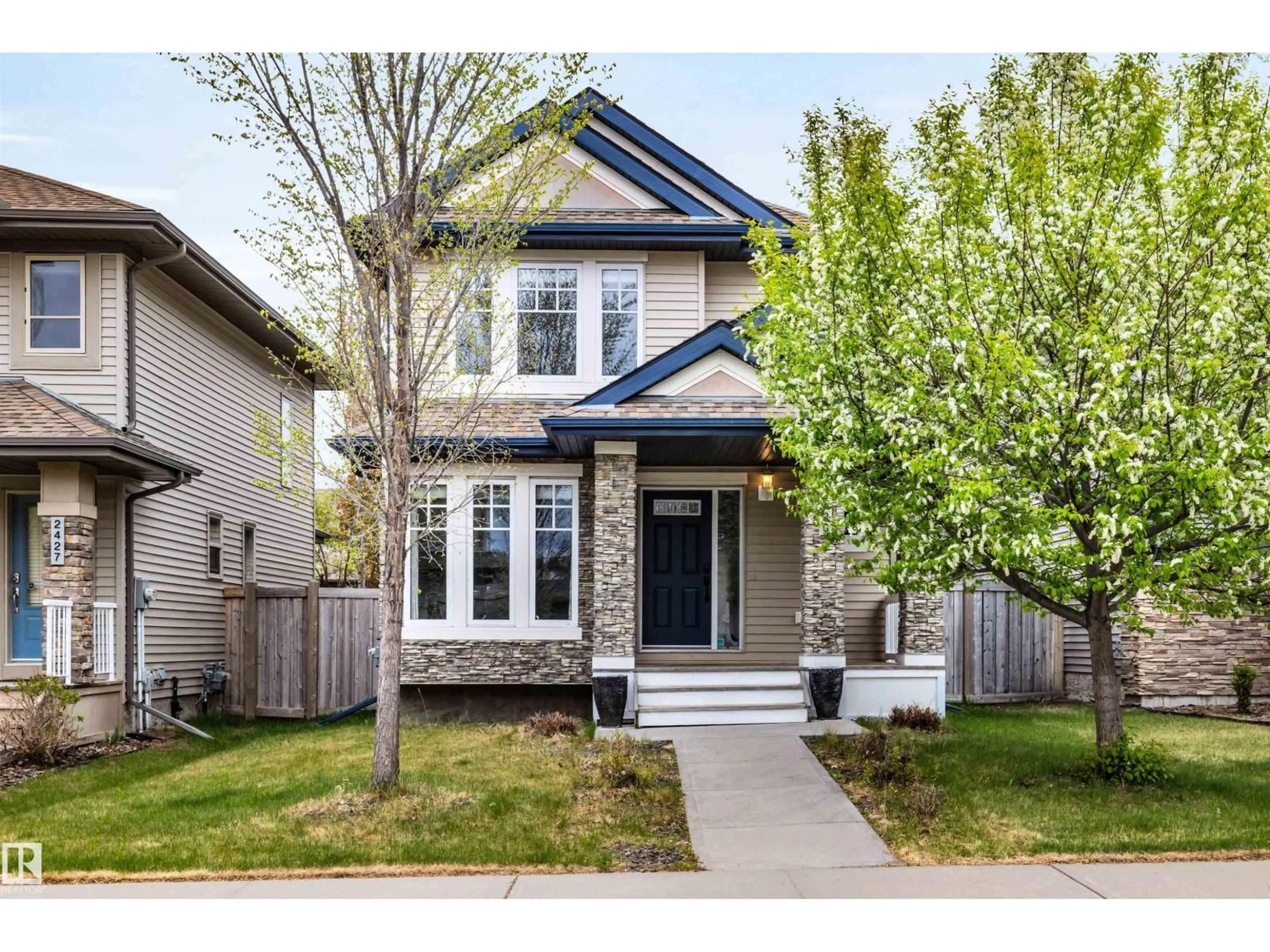 Home with vinyl exterior material, street for 2429 AUSTIN CR, Edmonton Alberta T6W0L3