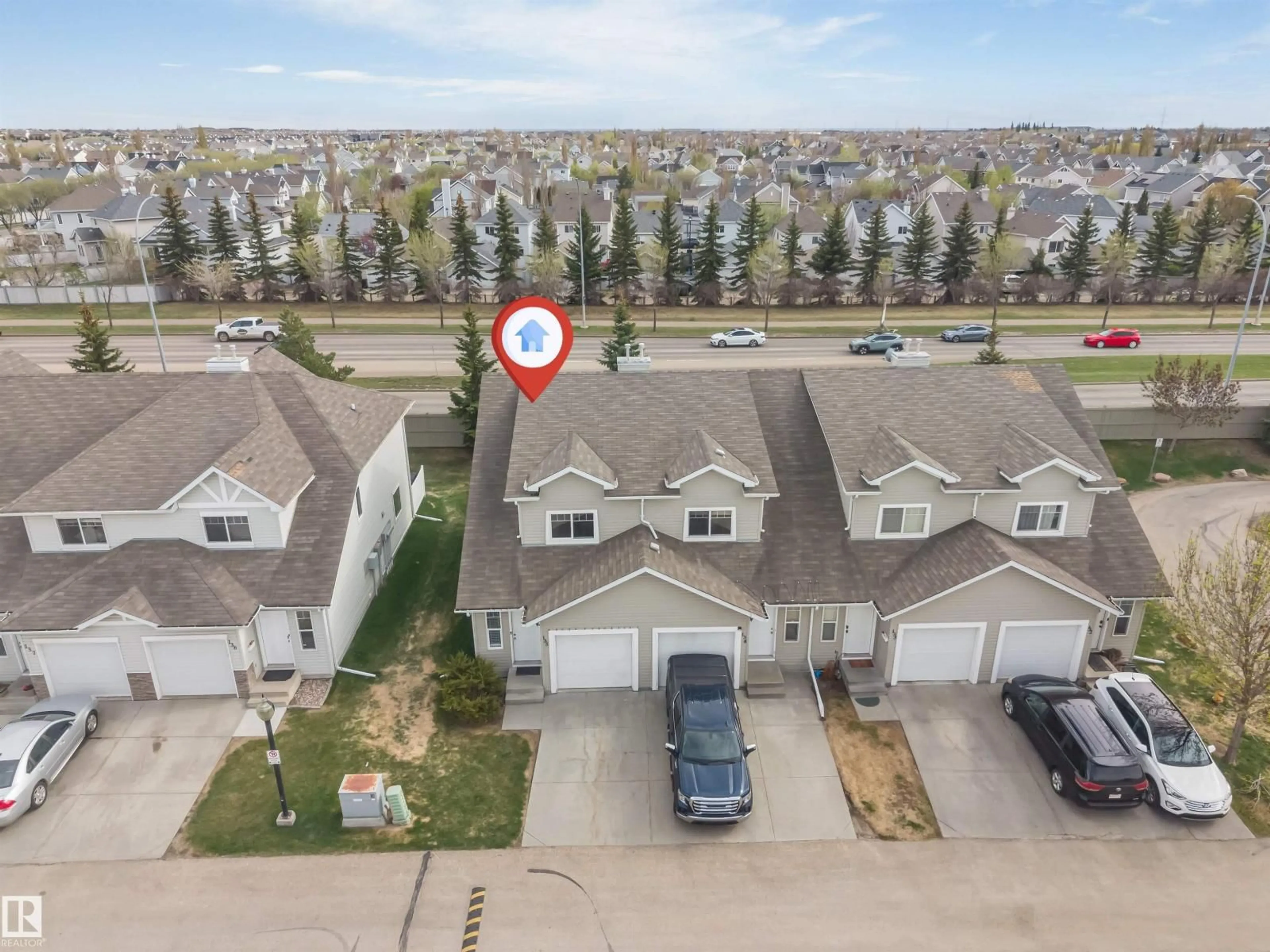 A pic from outside/outdoor area/front of a property/back of a property/a pic from drone, street for #135 - 150 EDWARDS DR, Edmonton Alberta T6X1M4