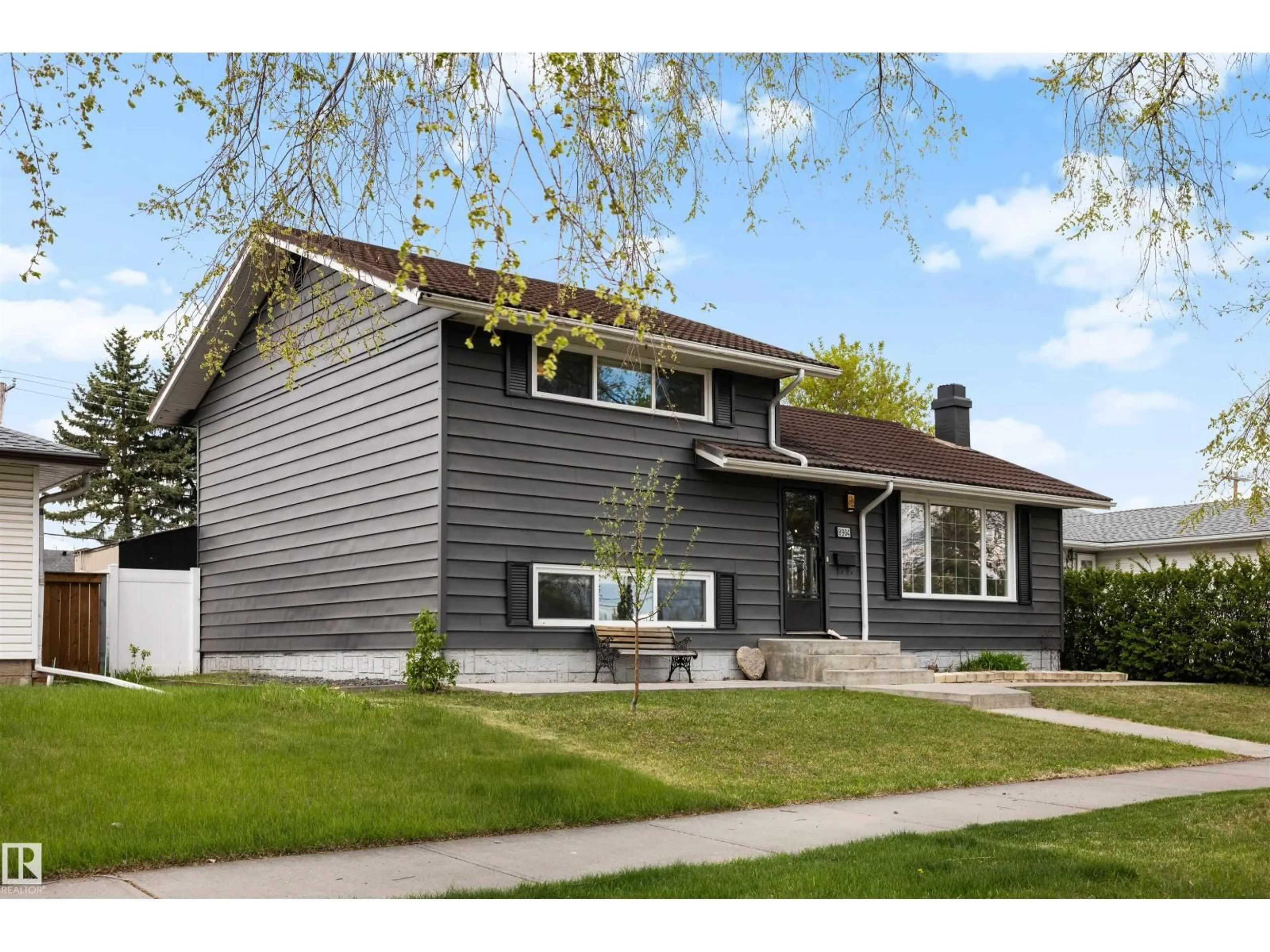 Home with vinyl exterior material, street for 8904 168 ST, Edmonton Alberta T5R2X2