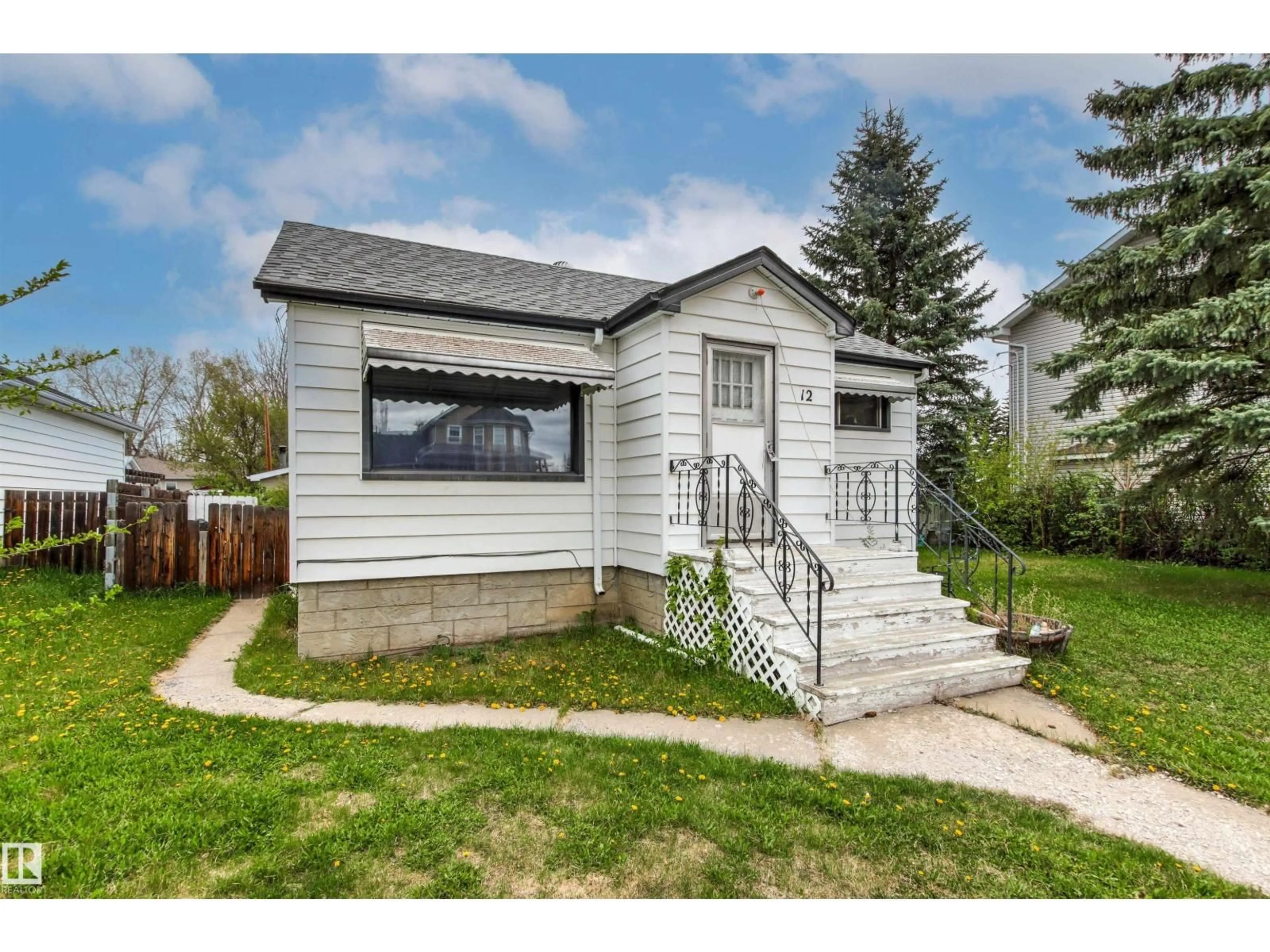 Home with vinyl exterior material, street for 12 KOOTENAY AV, Devon Alberta T9G1J1
