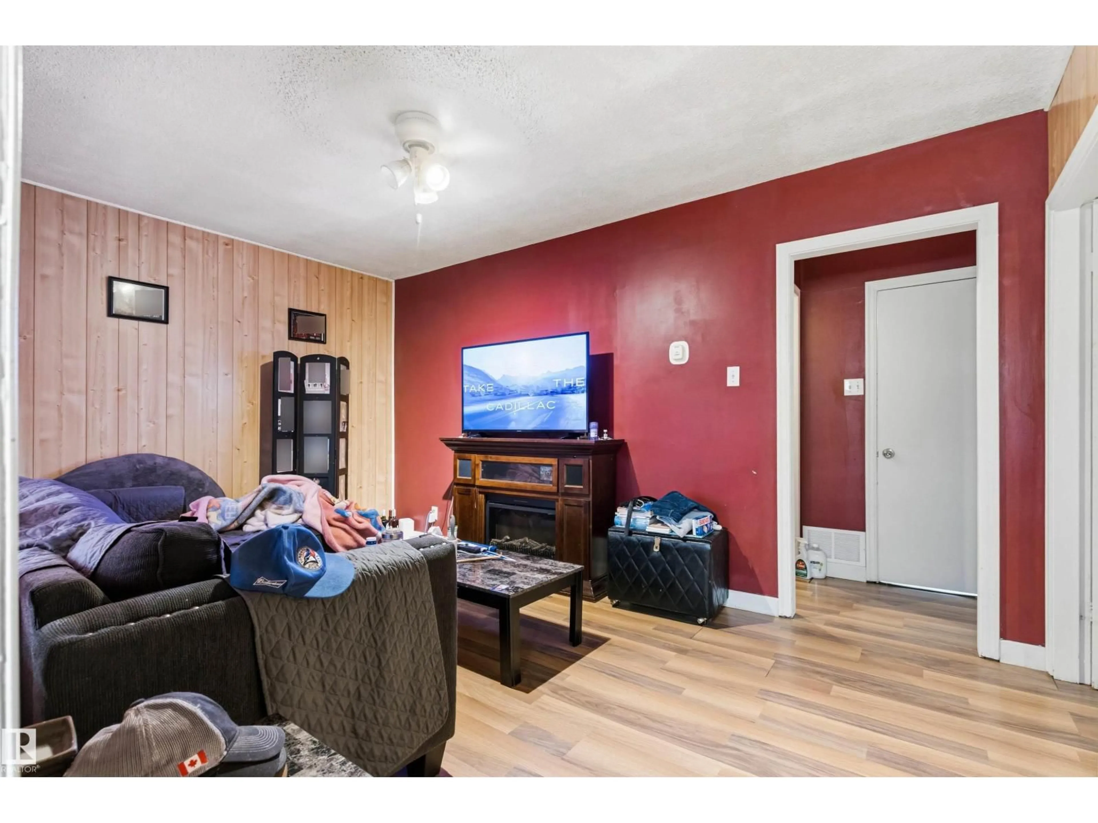 Living room with furniture, wood/laminate floor for 12 KOOTENAY AV, Devon Alberta T9G1J1