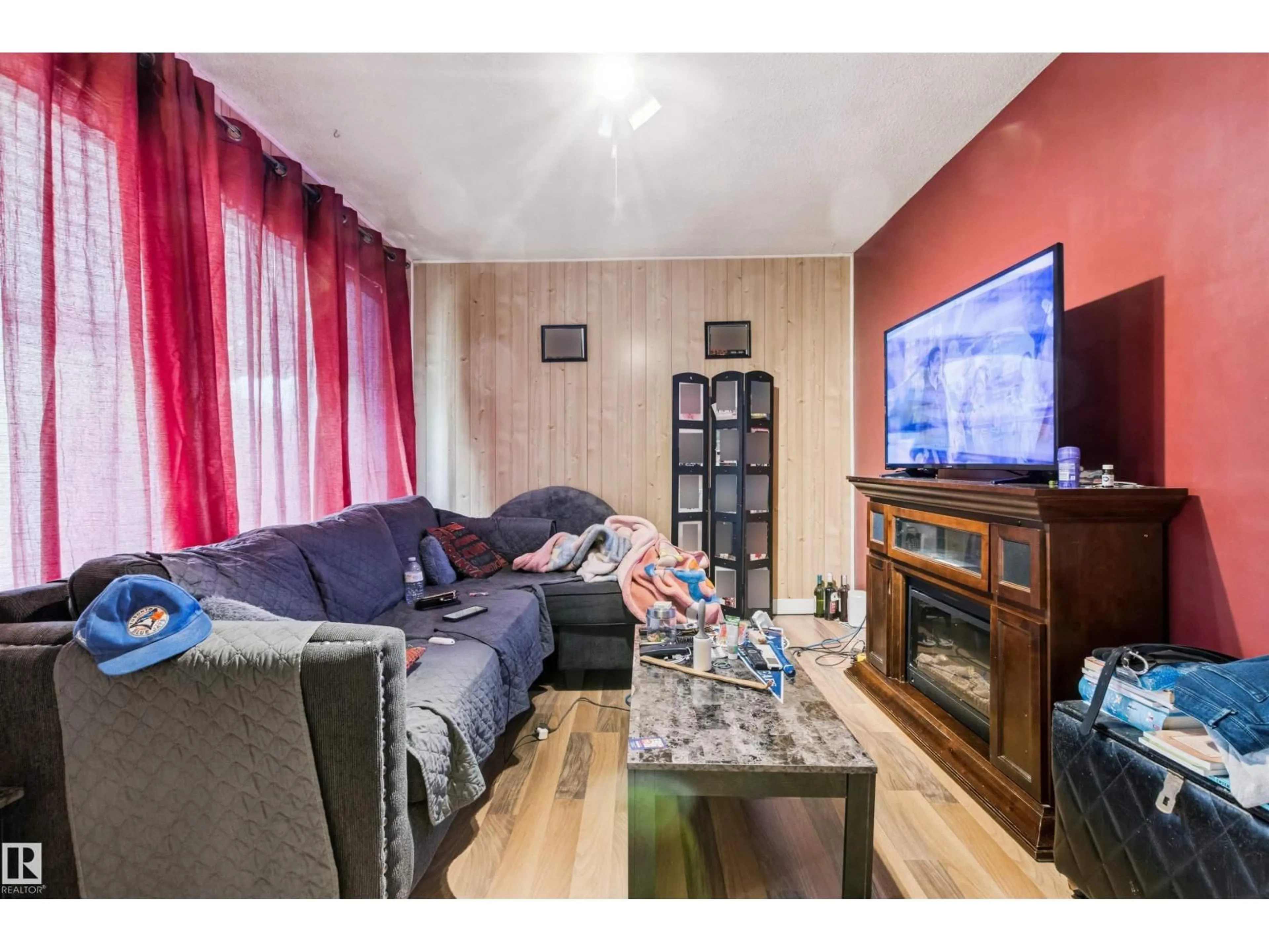 Living room with furniture, wood/laminate floor for 12 KOOTENAY AV, Devon Alberta T9G1J1