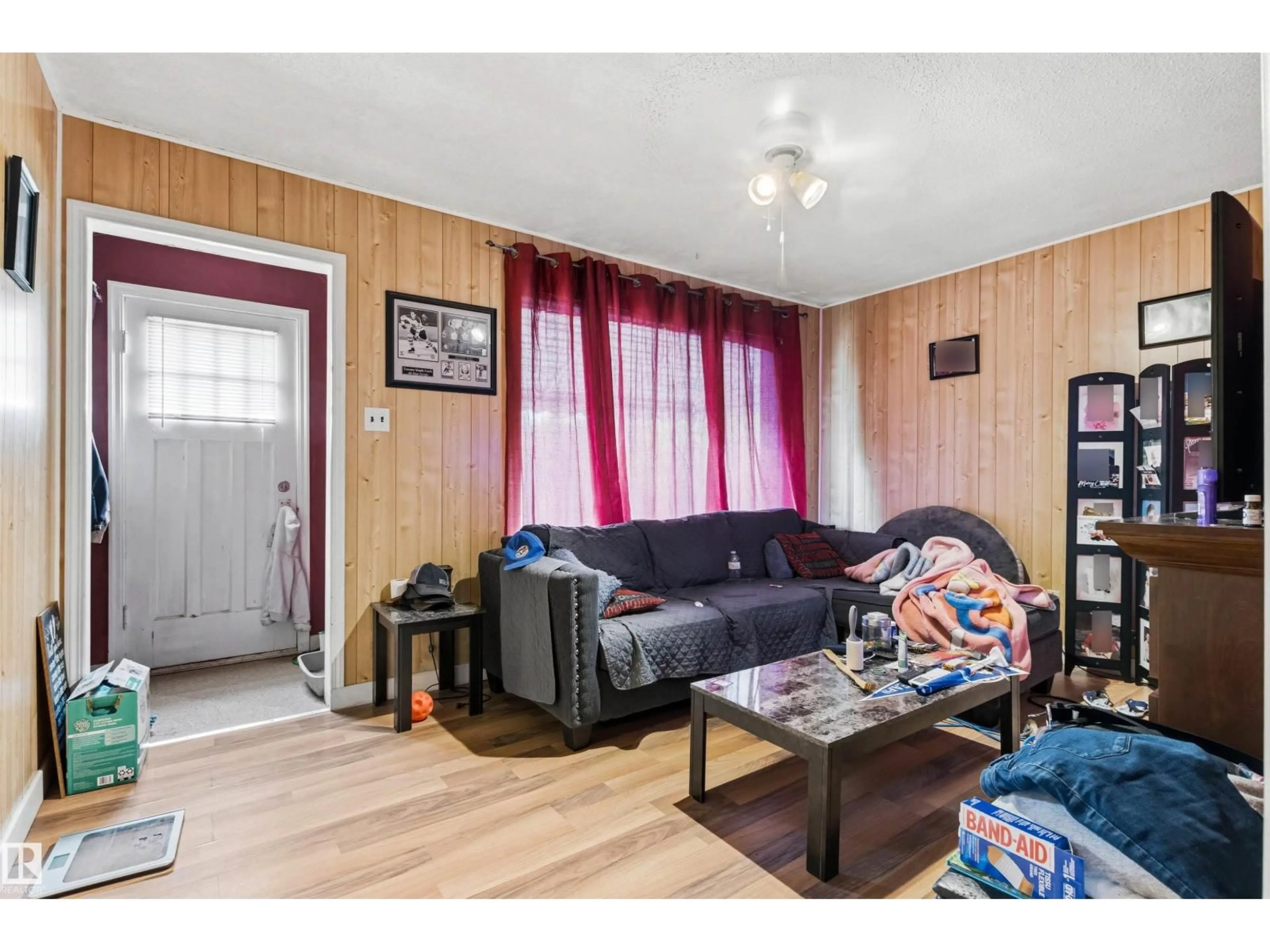 Living room with furniture, wood/laminate floor for 12 KOOTENAY AV, Devon Alberta T9G1J1