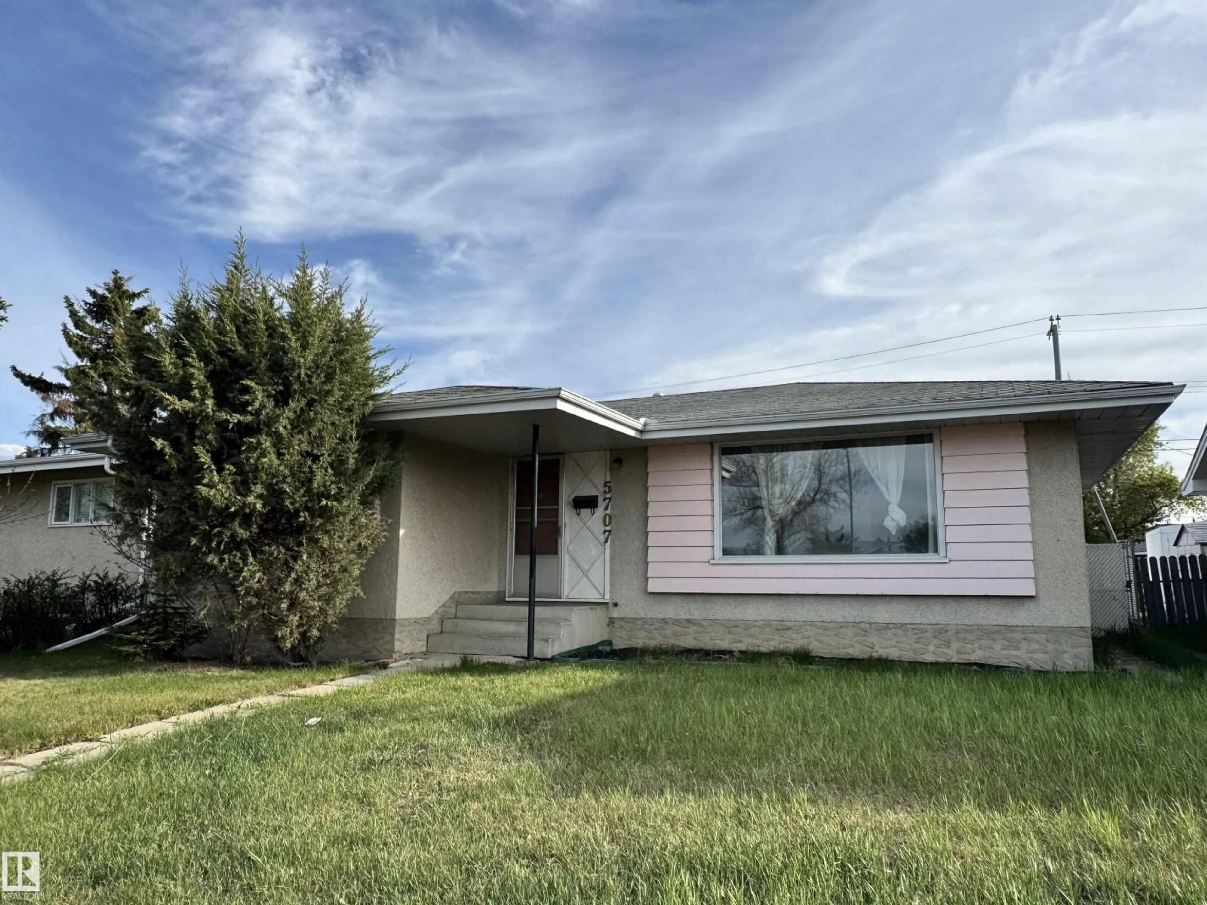 Home with vinyl exterior material, street for 5707 90 AV, Edmonton Alberta T6B0P1