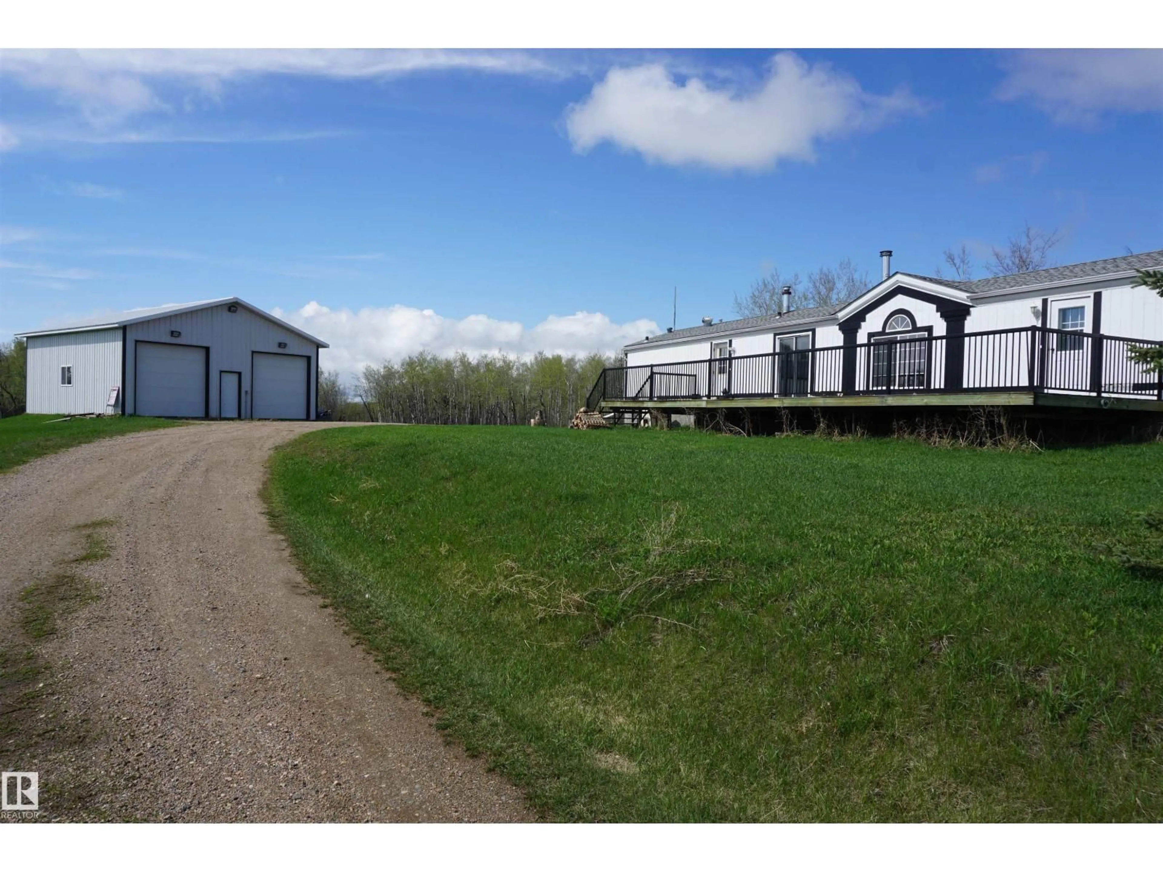 A pic from outside/outdoor area/front of a property/back of a property/a pic from drone, street for 102 - 59502 RNG ROAD, Rural St. Paul County Alberta T0A2K0
