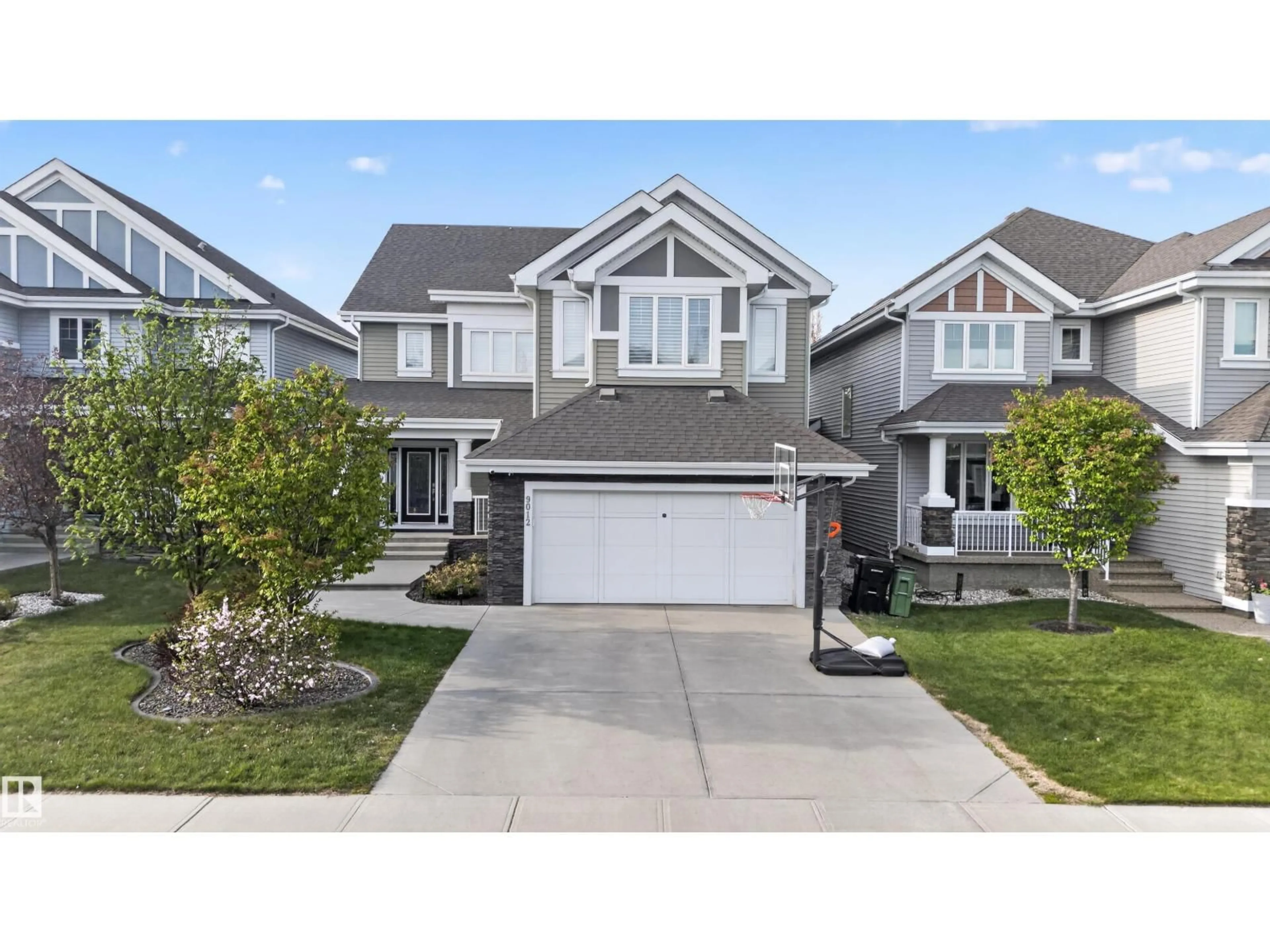 Home with vinyl exterior material, street for SW - 9012 24 AV, Edmonton Alberta T6X1A6