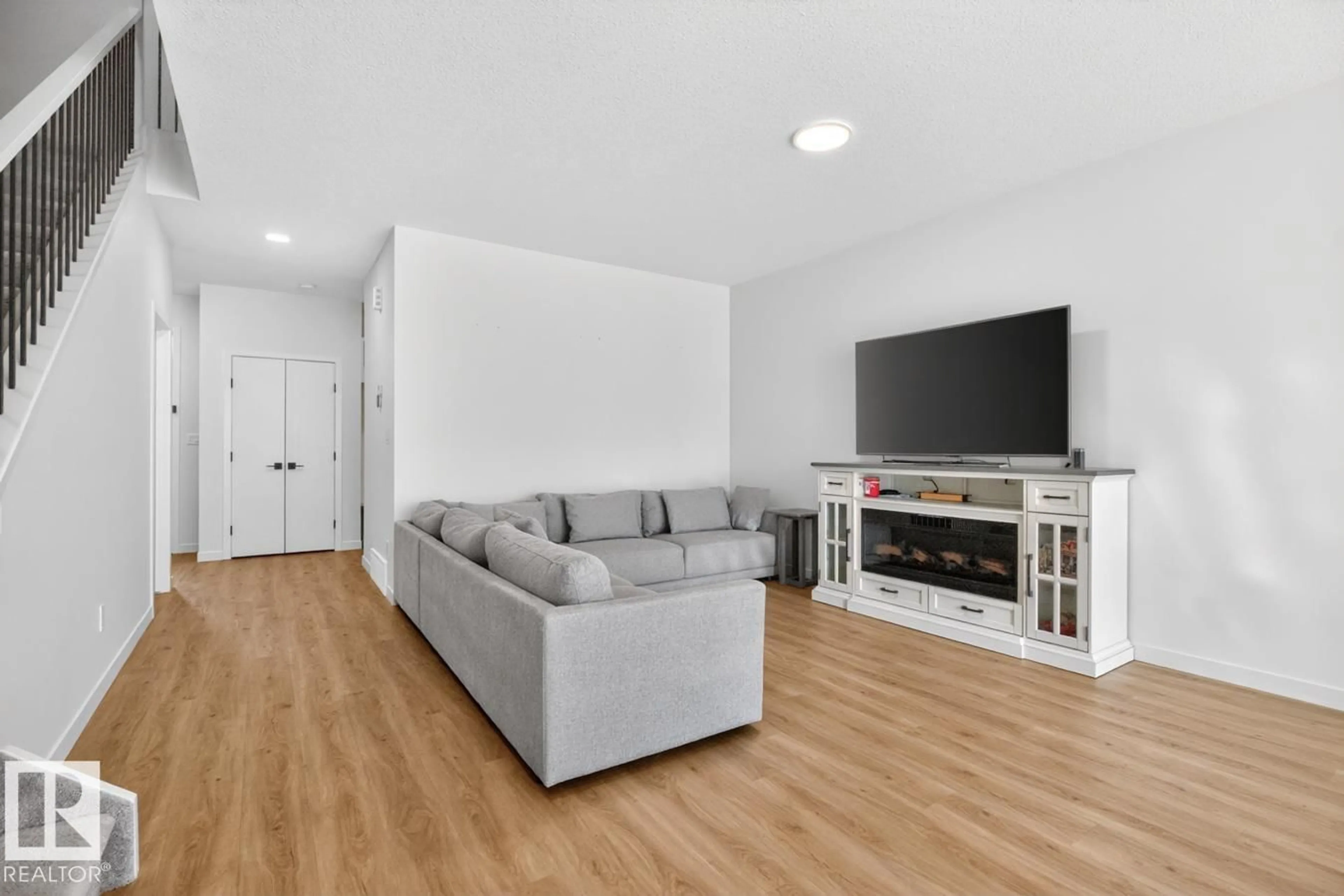 Living room with furniture, wood/laminate floor for 17347 100 ST, Edmonton Alberta T5X0M5