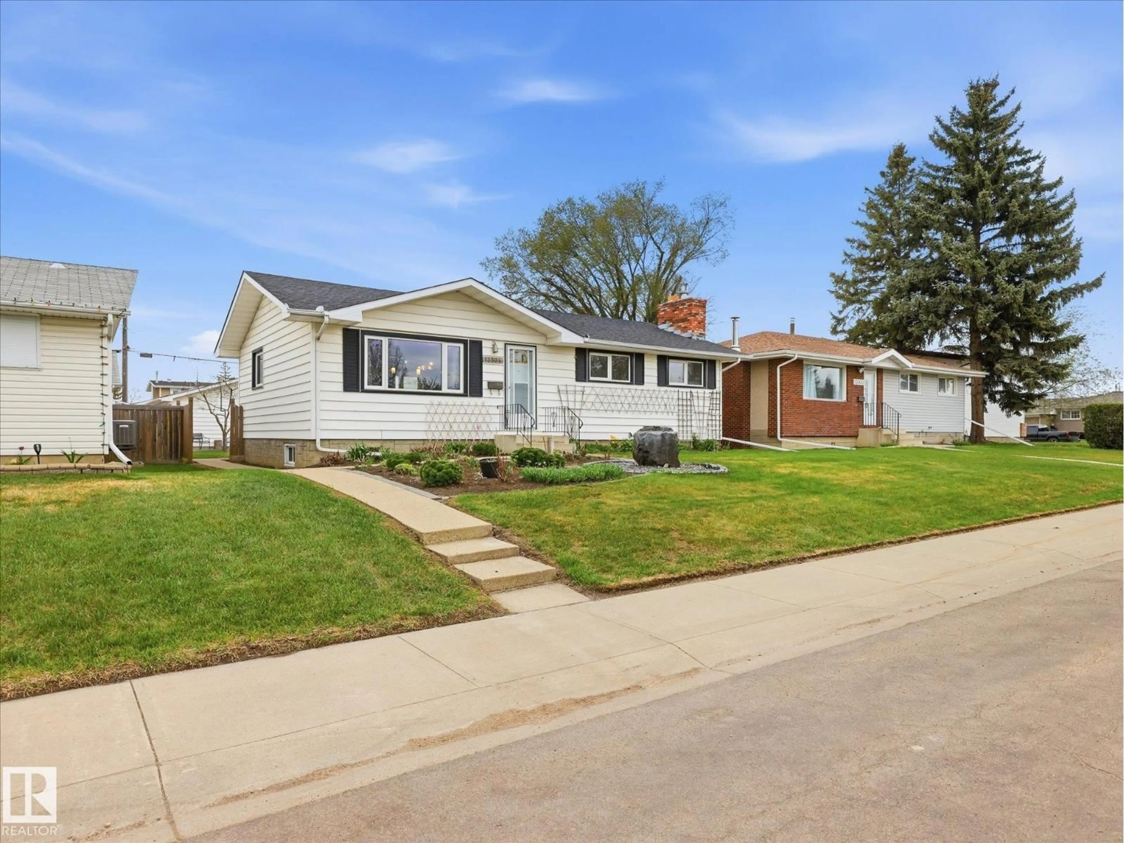 Home with vinyl exterior material, street for 13504 116 ST NW, Edmonton Alberta T5E5J1