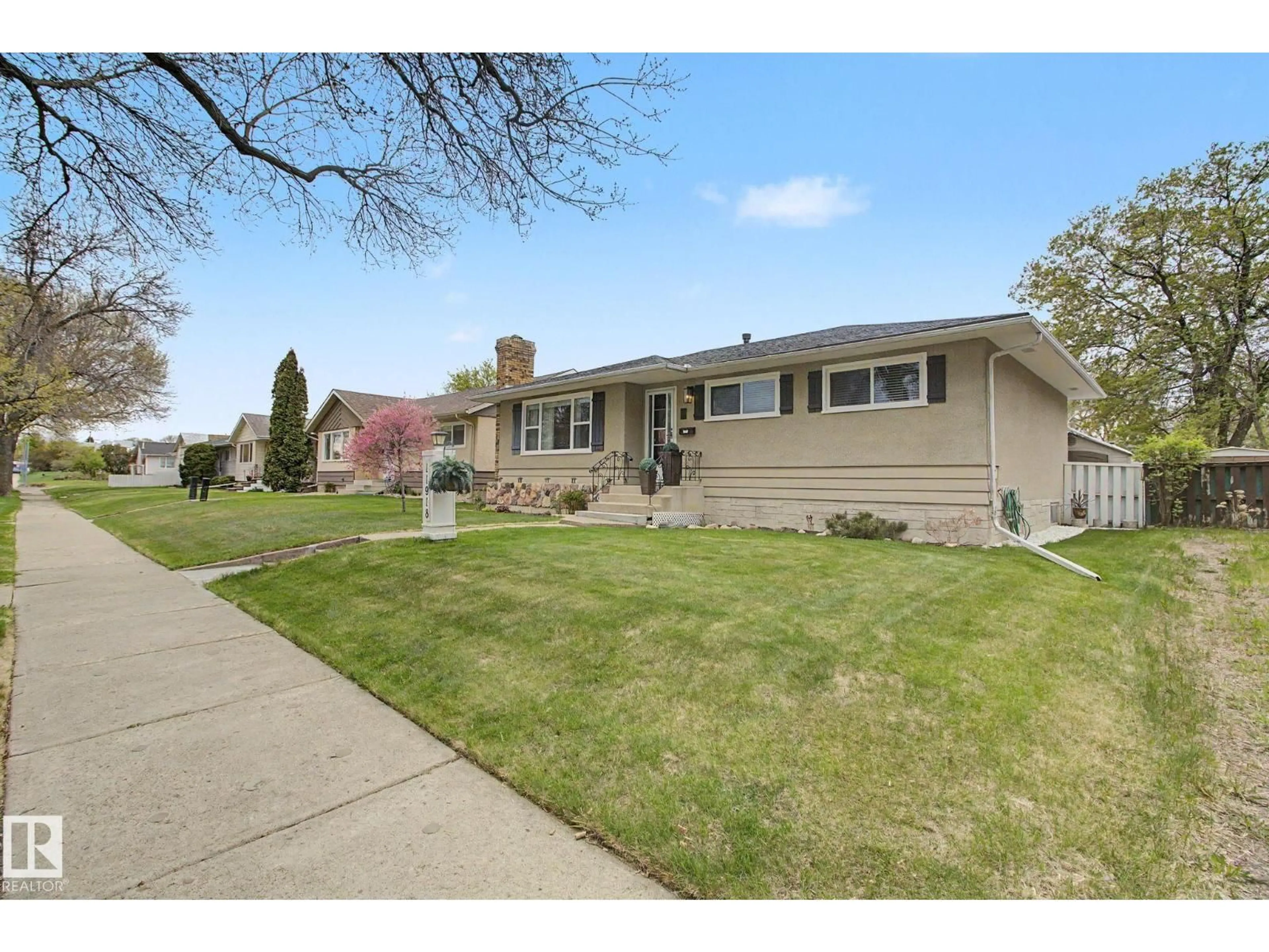 Home with vinyl exterior material, street for NW - 11918 43 ST, Edmonton Alberta T5W2P6