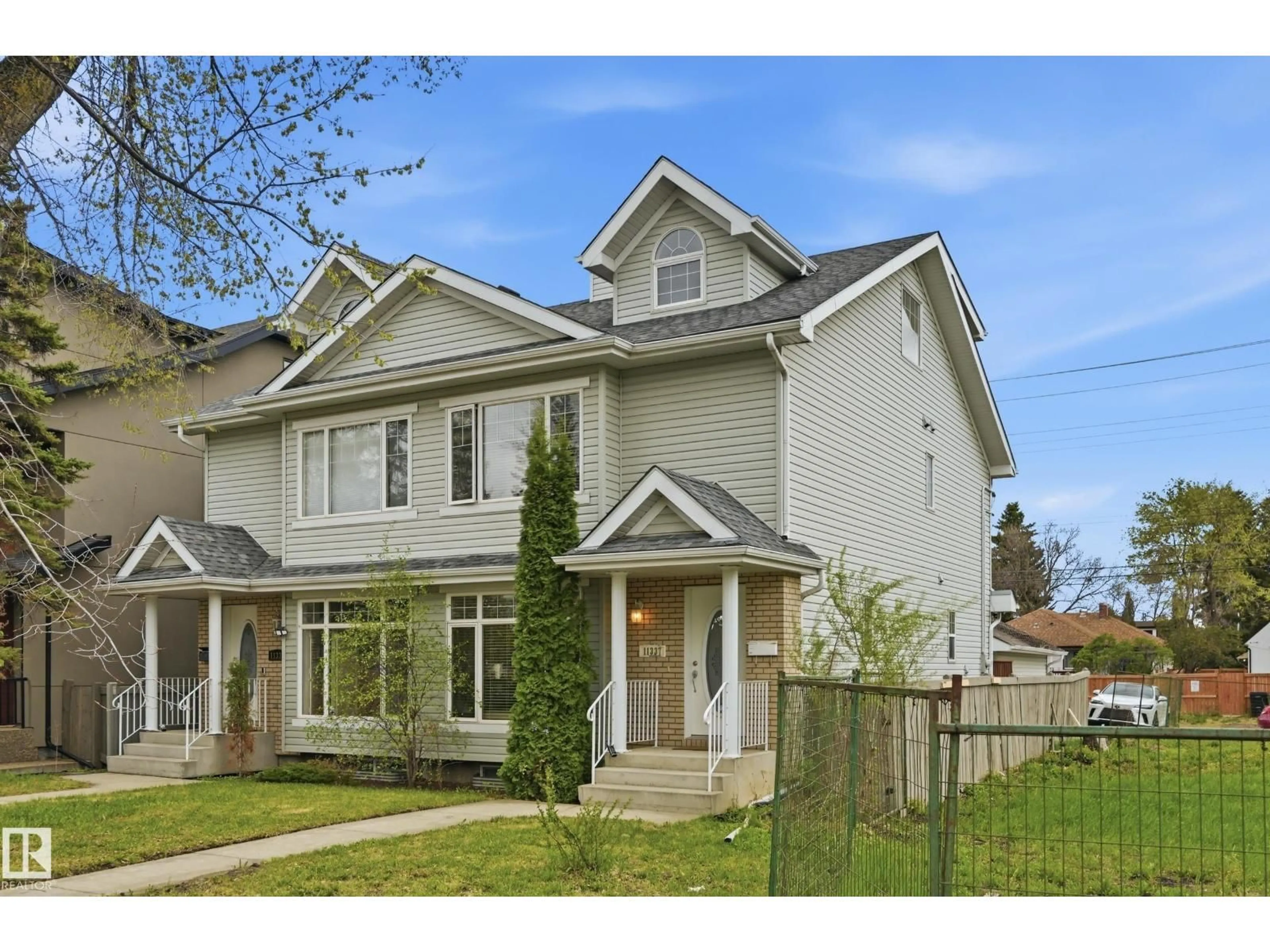Home with vinyl exterior material, street for 11337 76 AV, Edmonton Alberta T6G0K3