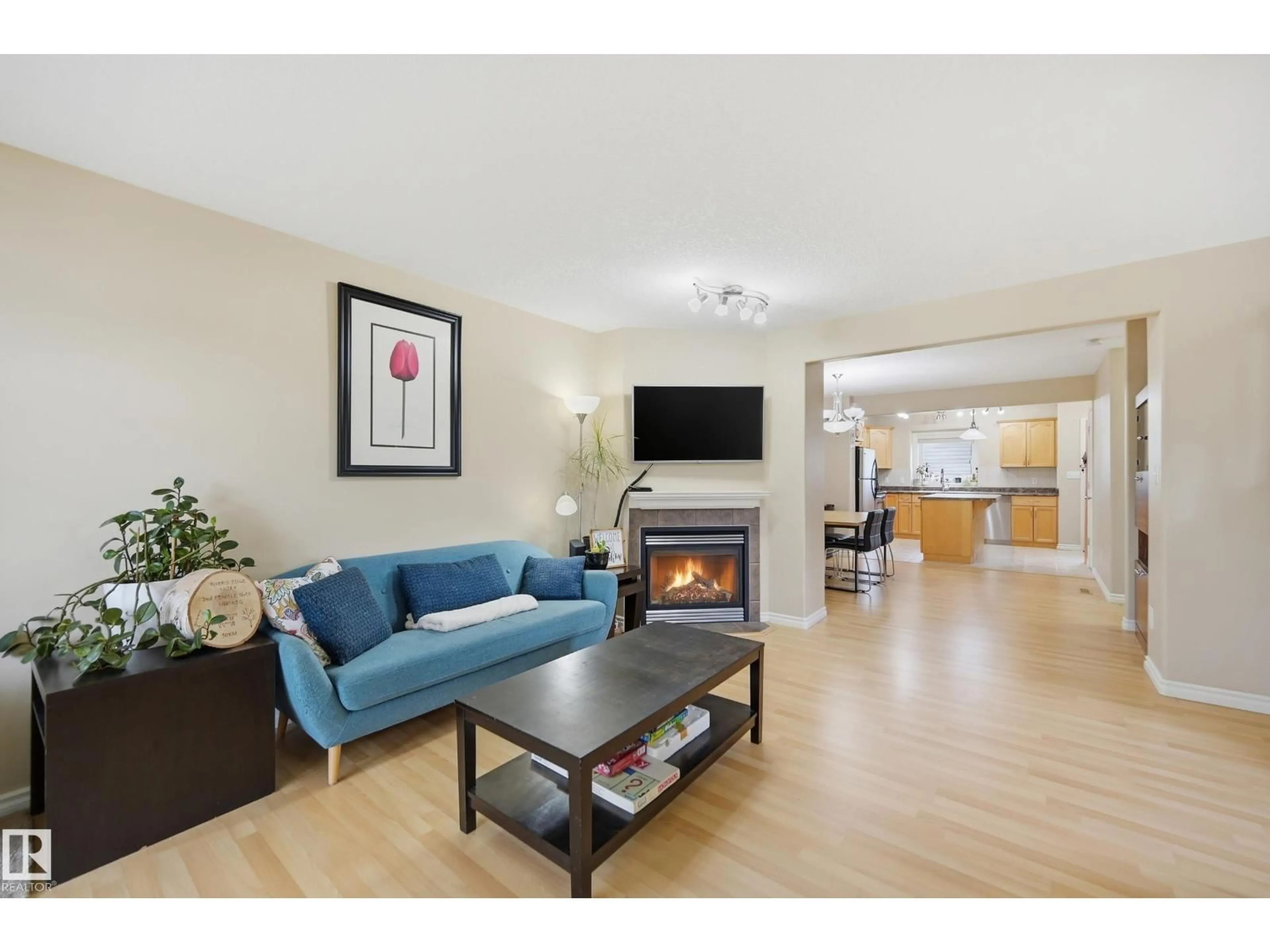 Living room with furniture, wood/laminate floor for 11337 76 AV, Edmonton Alberta T6G0K3