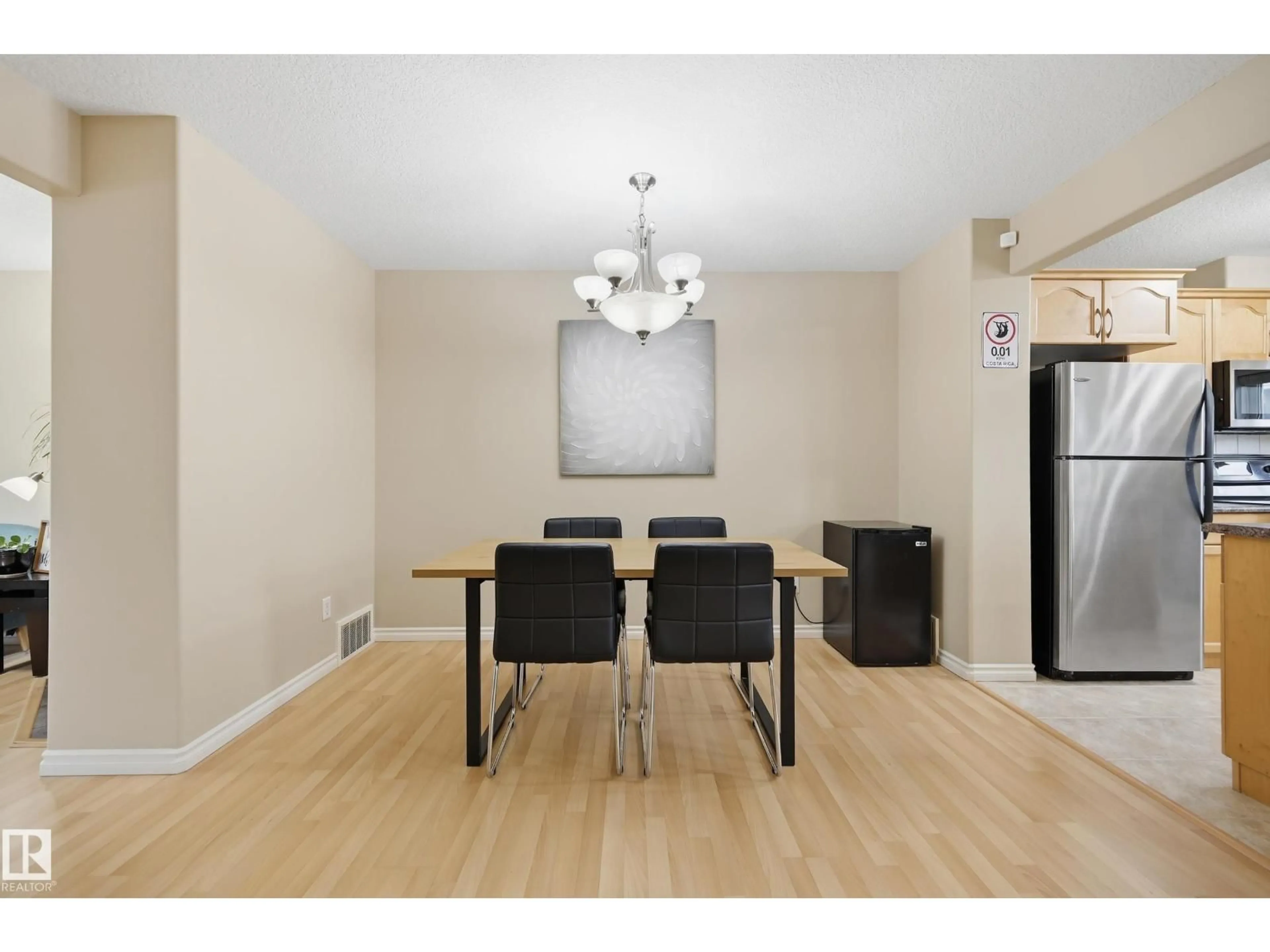 Dining room, wood/laminate floor for 11337 76 AV, Edmonton Alberta T6G0K3