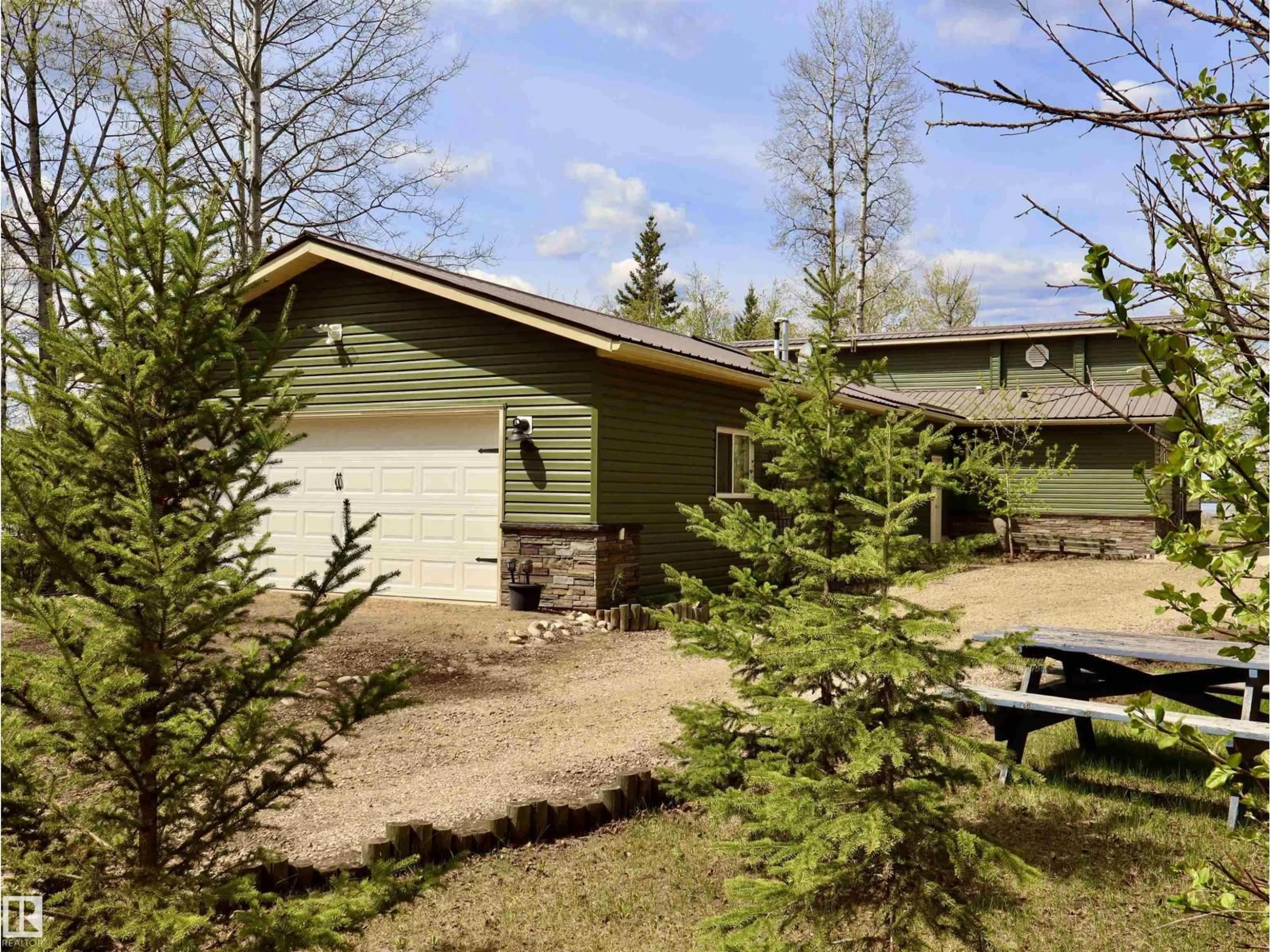 A pic from outside/outdoor area/front of a property/back of a property/a pic from drone, forest/trees view for #26 - 5508 TWP RD 593 A, Rural Barrhead County Alberta T7N1N3