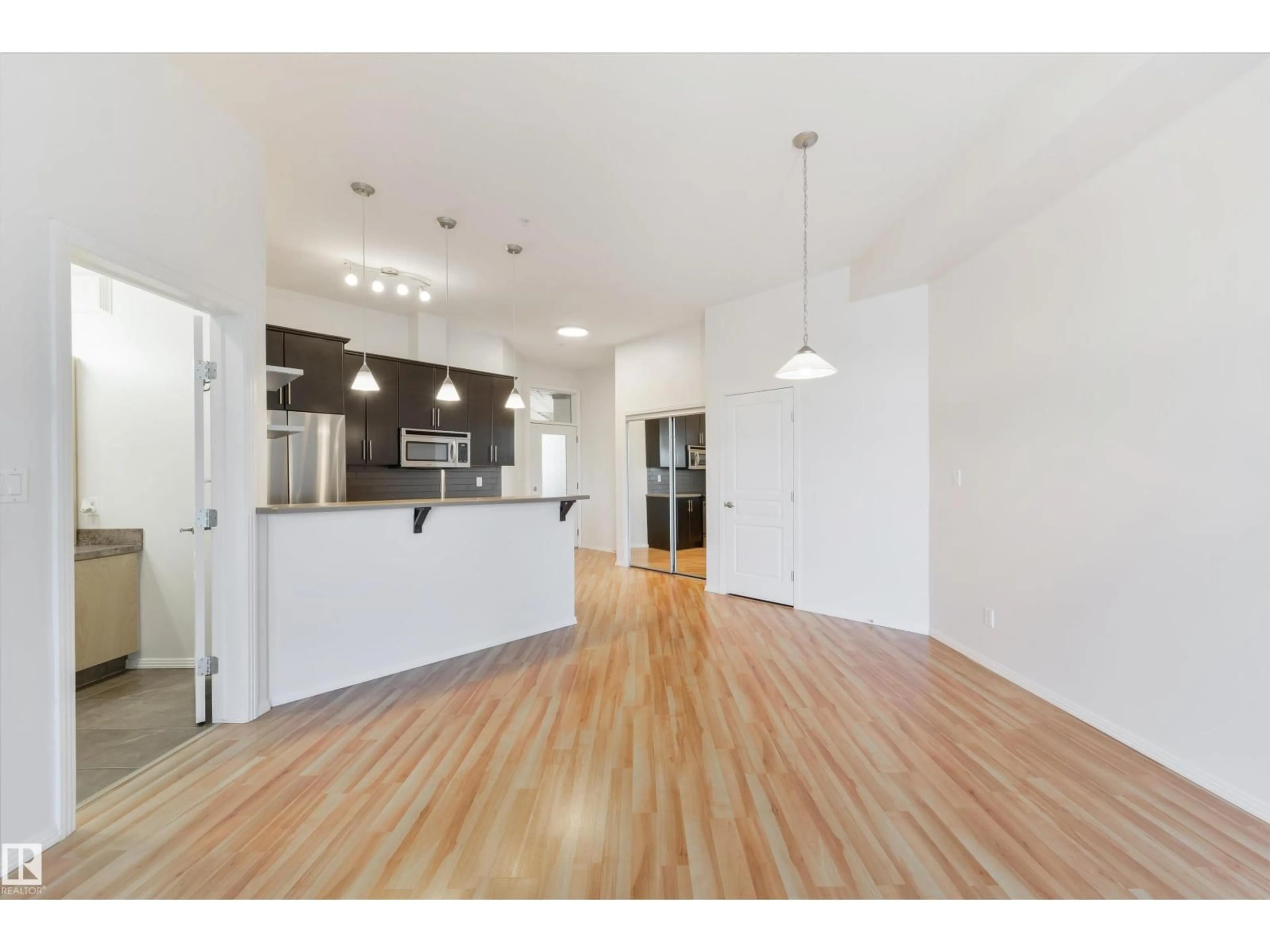 Open concept kitchen, wood/laminate floor for 405 - 10531 117 ST, Edmonton Alberta T5H0A8