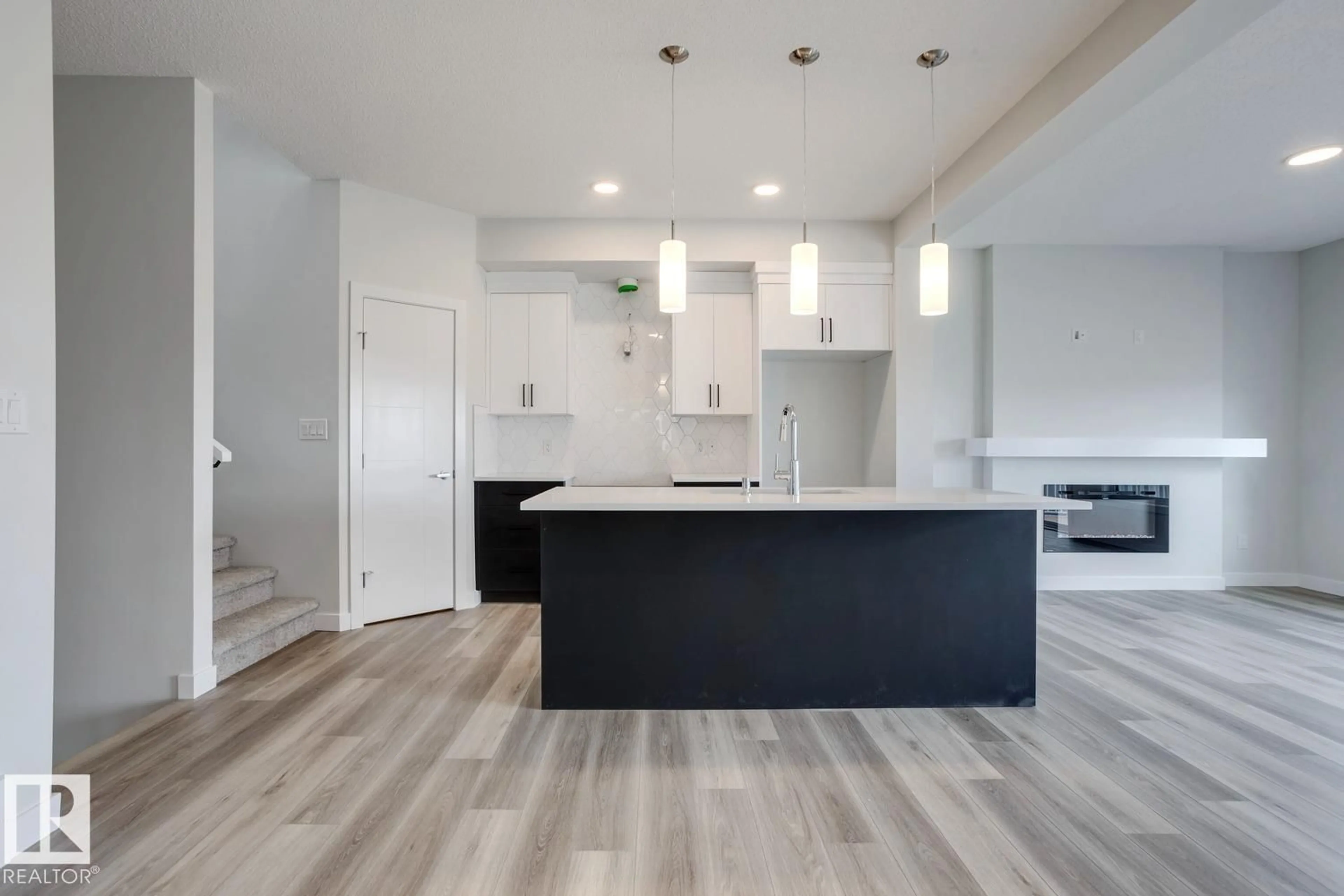 Open concept kitchen, wood/laminate floor for 308 BRAE WY, Leduc Alberta T5P4P4