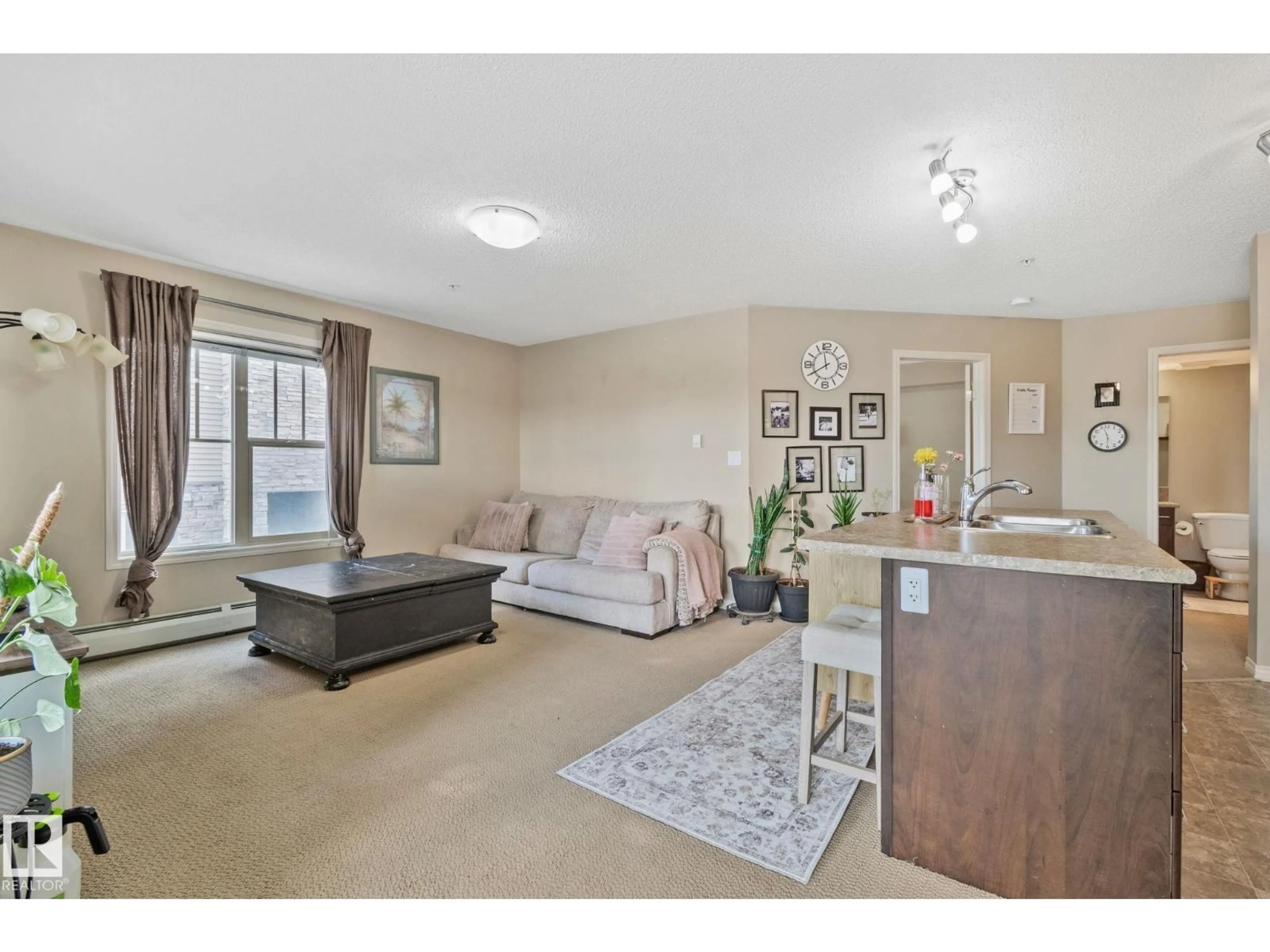 Living room with furniture, unknown for 206 - 103 AMBLESIDE DR, Edmonton Alberta T6W0J4