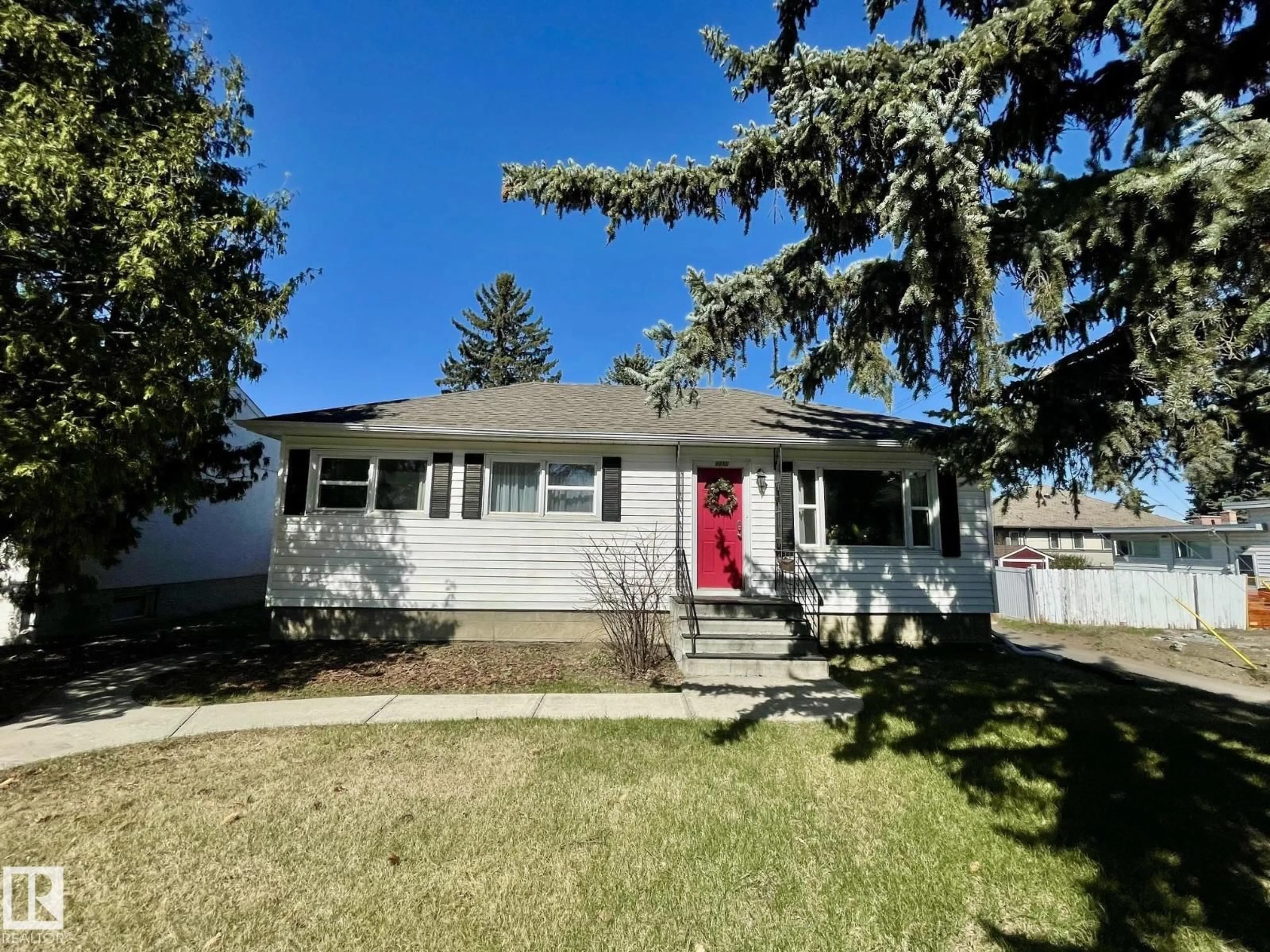 Home with vinyl exterior material, street for NW - 9650 86 ST, Edmonton Alberta T6C3E9
