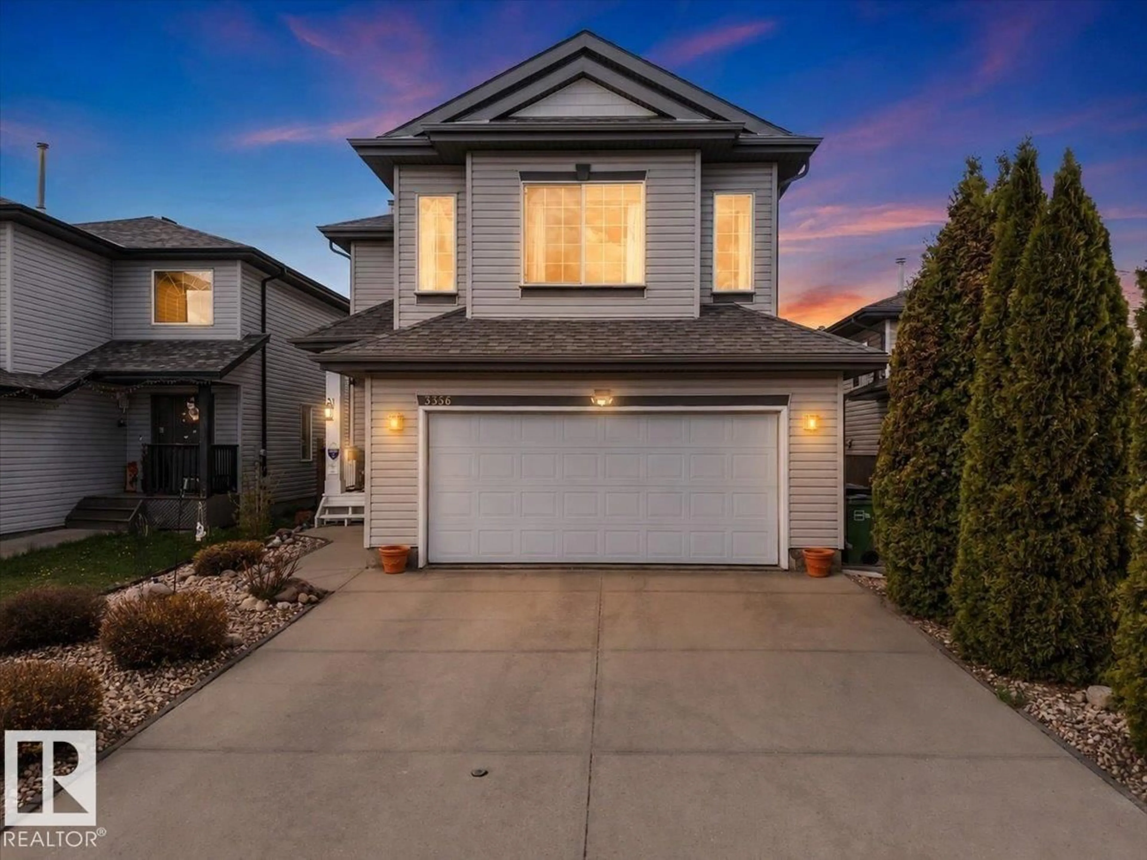 Home with vinyl exterior material, street for 3356 25 AVE, Edmonton Alberta T6T1Y4