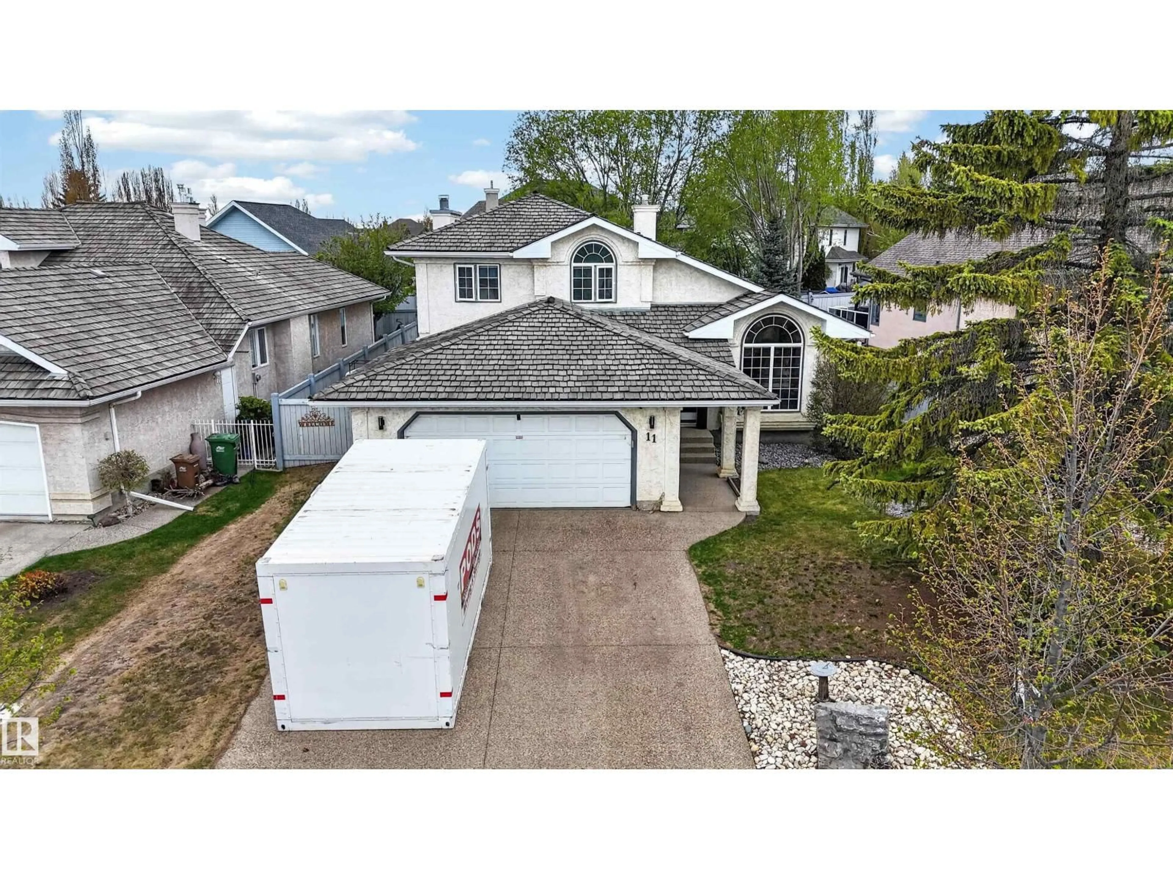 A pic from outside/outdoor area/front of a property/back of a property/a pic from drone, street for 11 LACOMBE DR, St. Albert Alberta T8N5S6