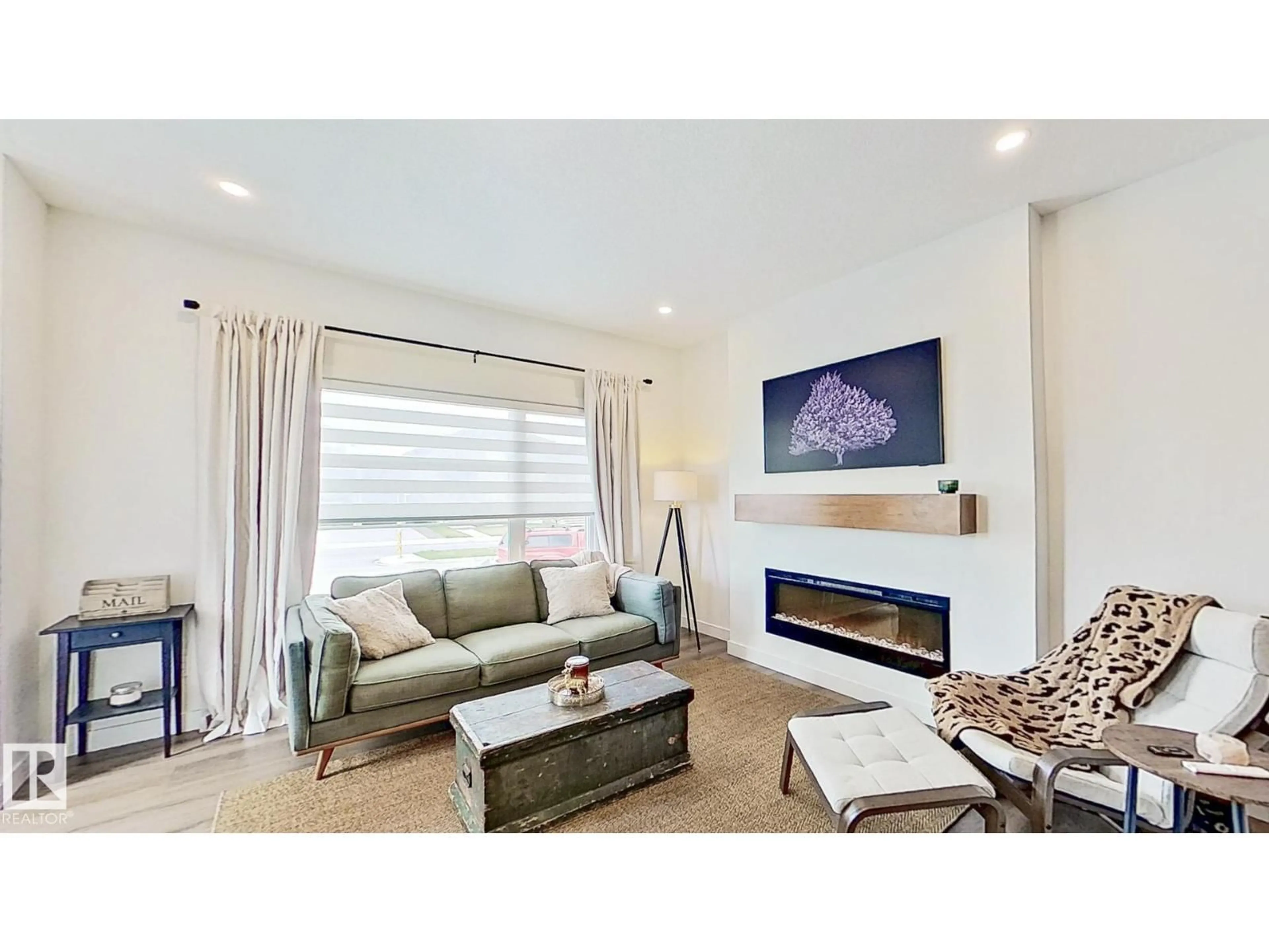 Living room with furniture, unknown for 37 EMBERSIDE LINK, Cochrane Alberta T4C3A8