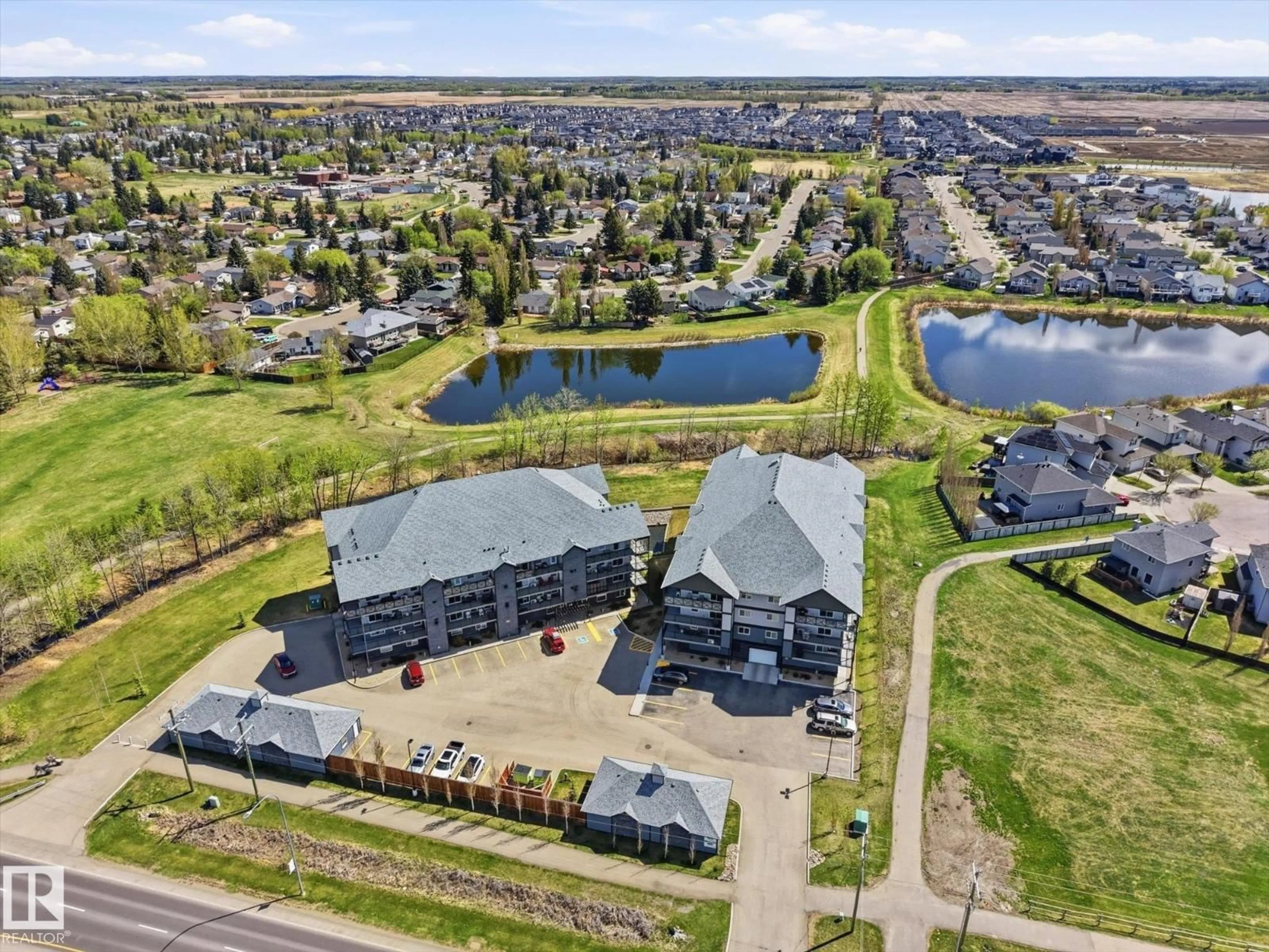 A pic from outside/outdoor area/front of a property/back of a property/a pic from drone, water/lake/river/ocean view for 206 - 4103 50 ST, Beaumont Alberta T4X2C7