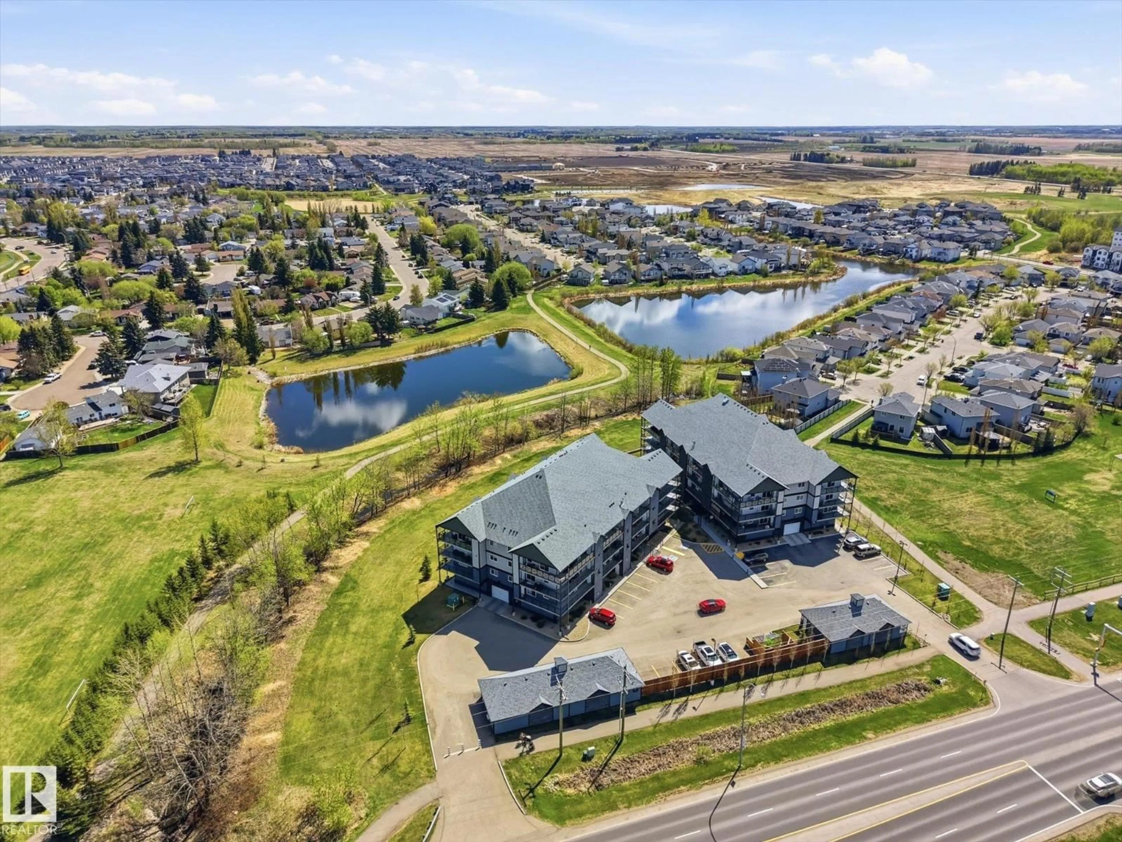A pic from outside/outdoor area/front of a property/back of a property/a pic from drone, water/lake/river/ocean view for 206 - 4103 50 ST, Beaumont Alberta T4X2C7