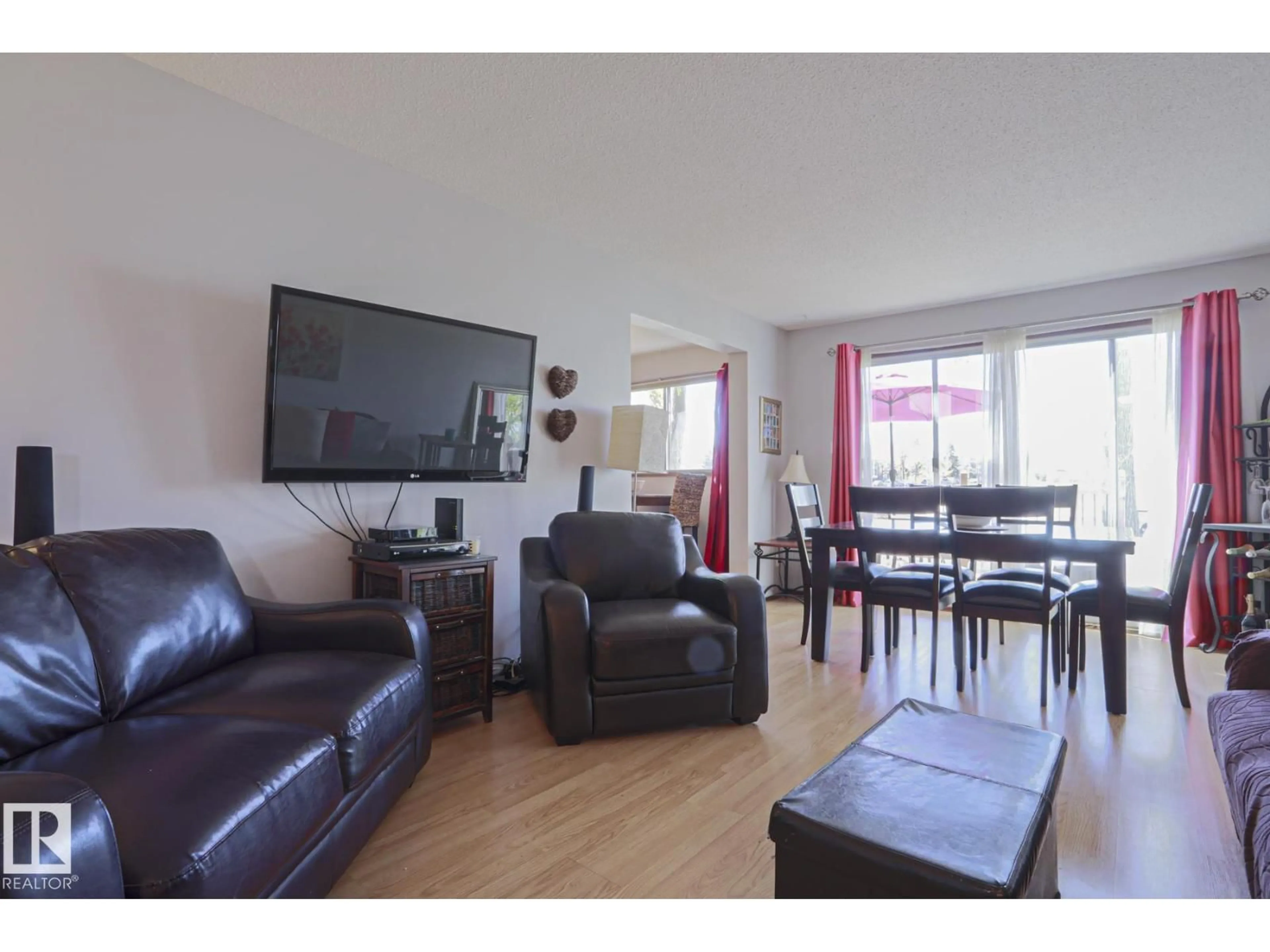 Living room with furniture, wood/laminate floor for NW - 9324 80 AV, Edmonton Alberta T6C0T9