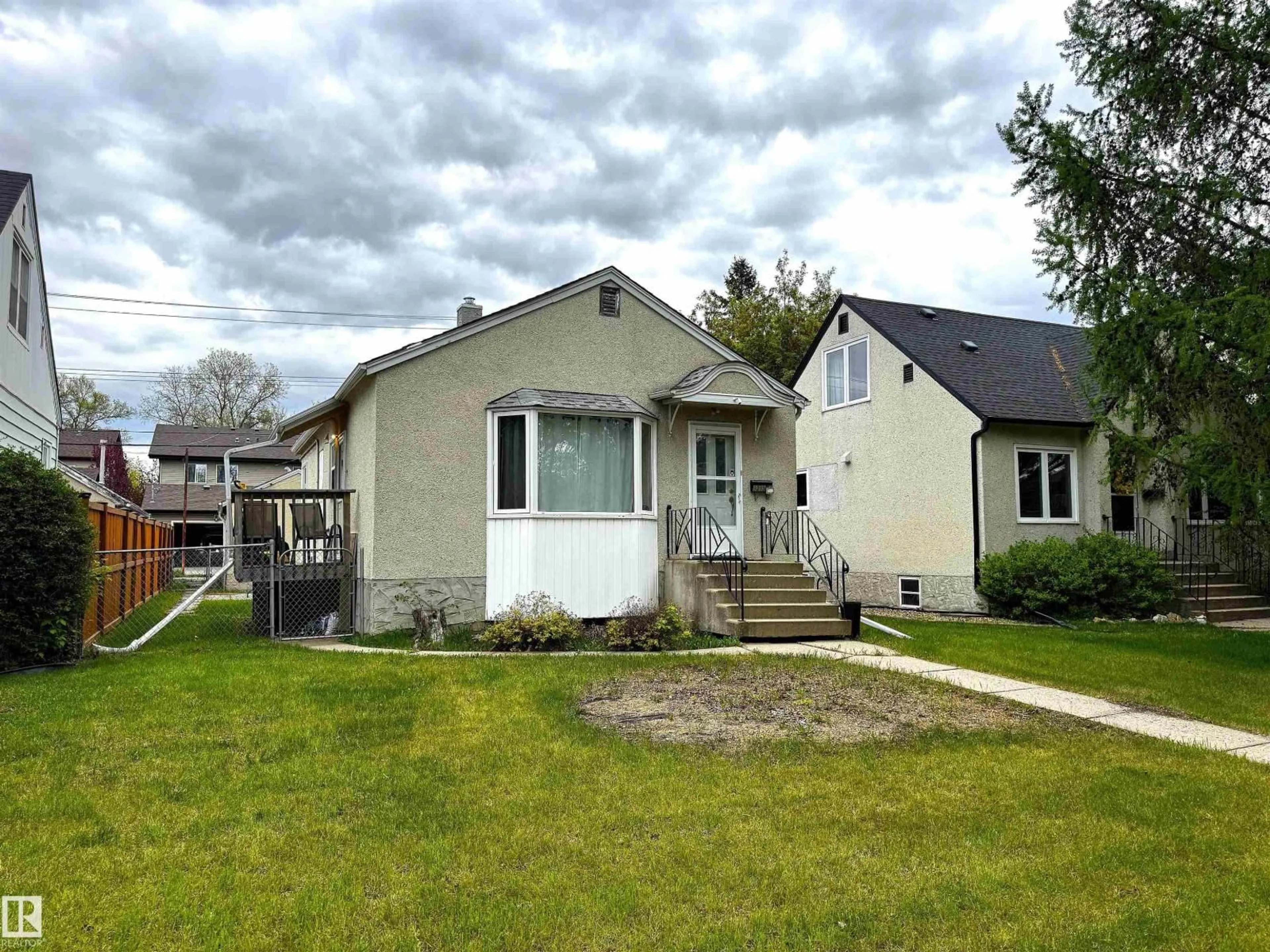 Home with vinyl exterior material, street for NW - 9015 91 ST, Edmonton Alberta T6C3N6