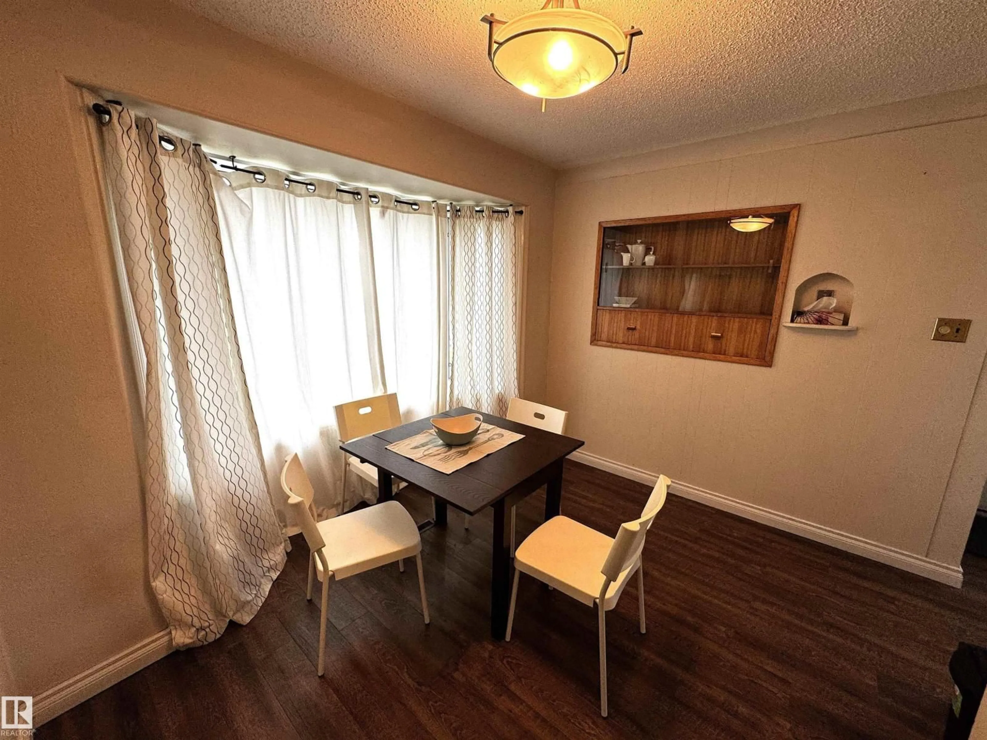 Dining room, wood/laminate floor for NW - 9015 91 ST, Edmonton Alberta T6C3N6