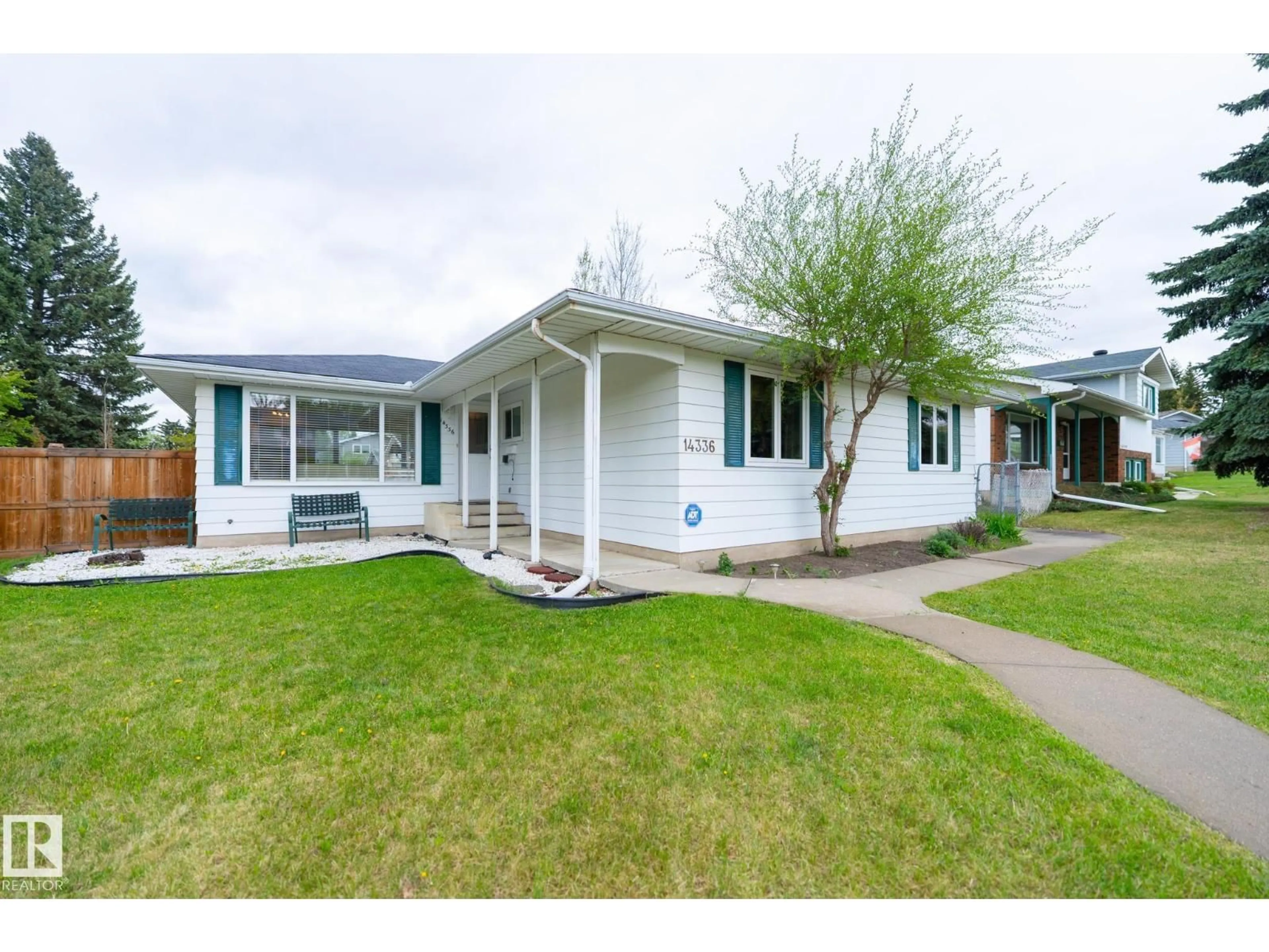 Home with vinyl exterior material, street for NW - 14336 58A AV, Edmonton Alberta T6H1E4