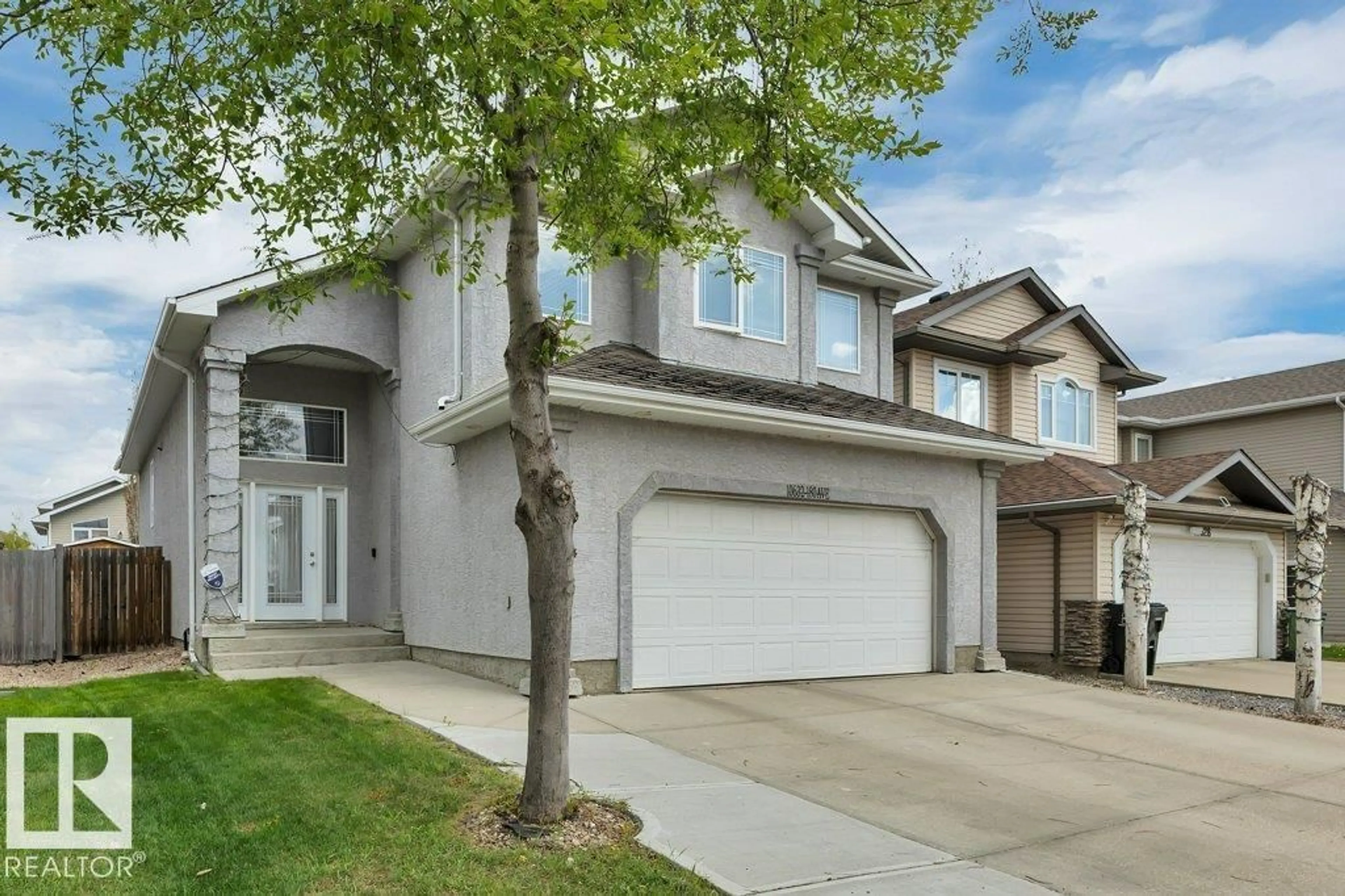 Home with vinyl exterior material, street for NW - 10632 180 AV, Edmonton Alberta T5X6J9