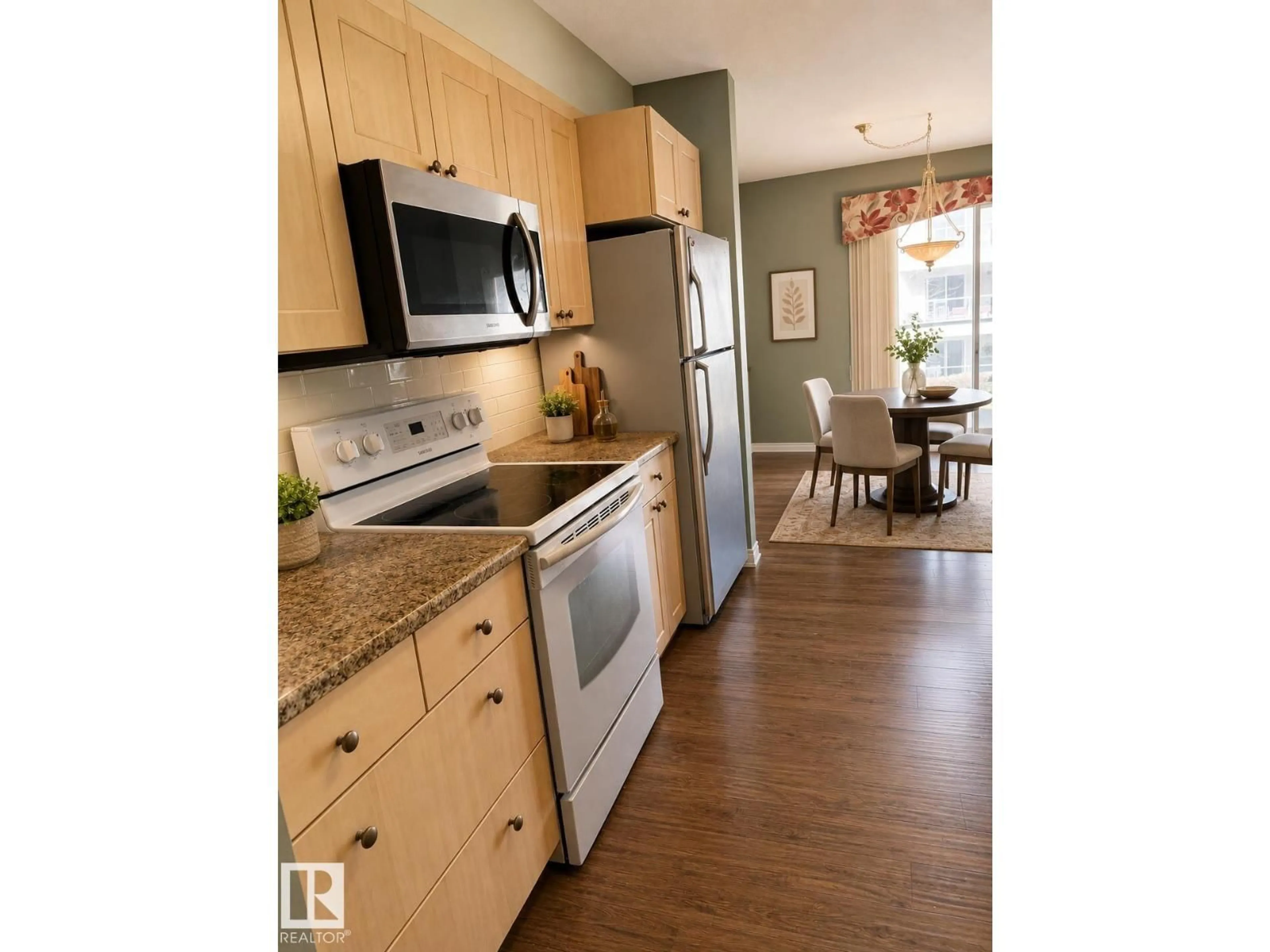 Open concept kitchen, wood/laminate floor for #219 - 9535 176 ST, Edmonton Alberta T5T6C8