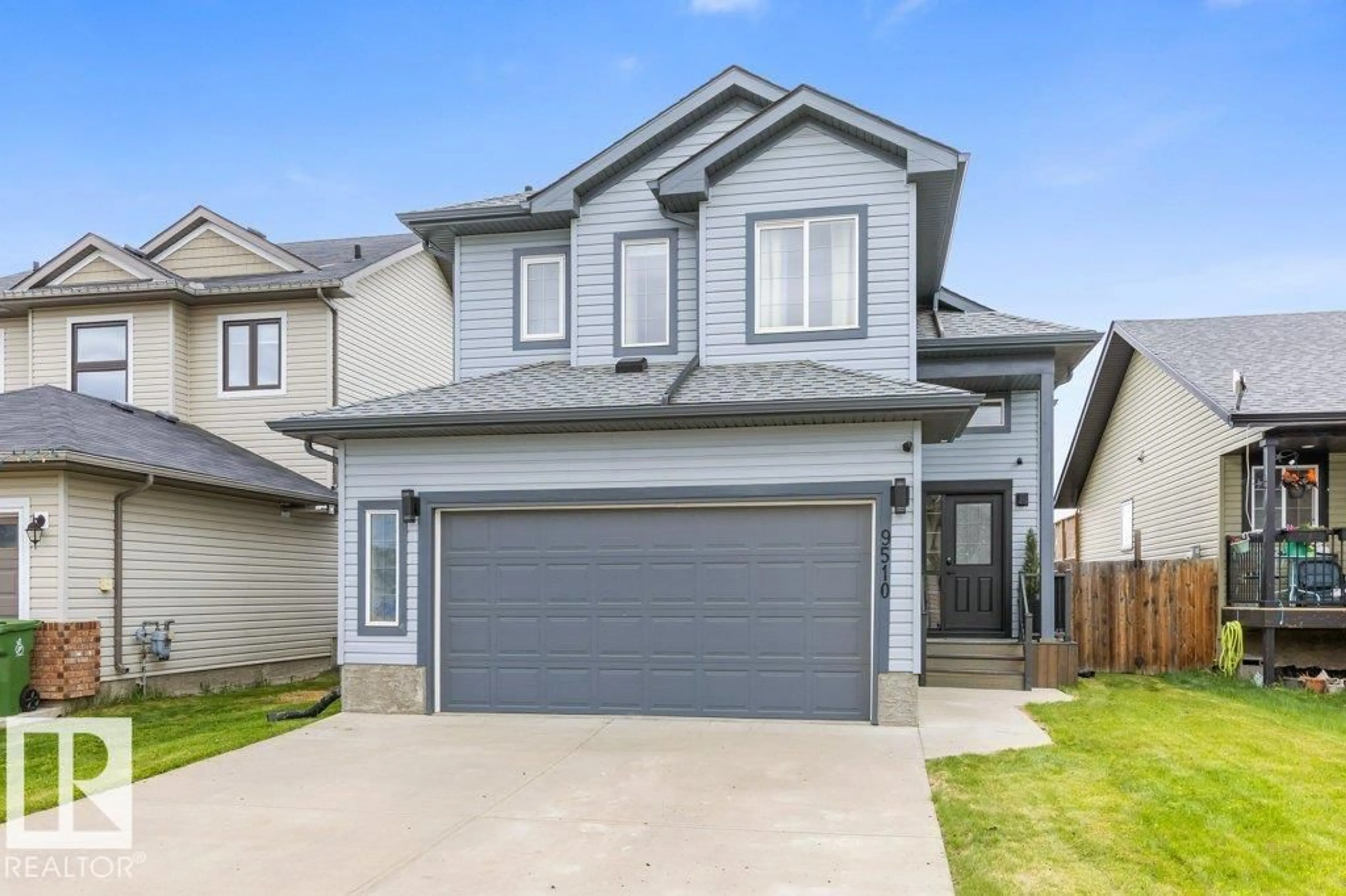 Home with vinyl exterior material, street for 9510 85 AV, Morinville Alberta T8R0A5