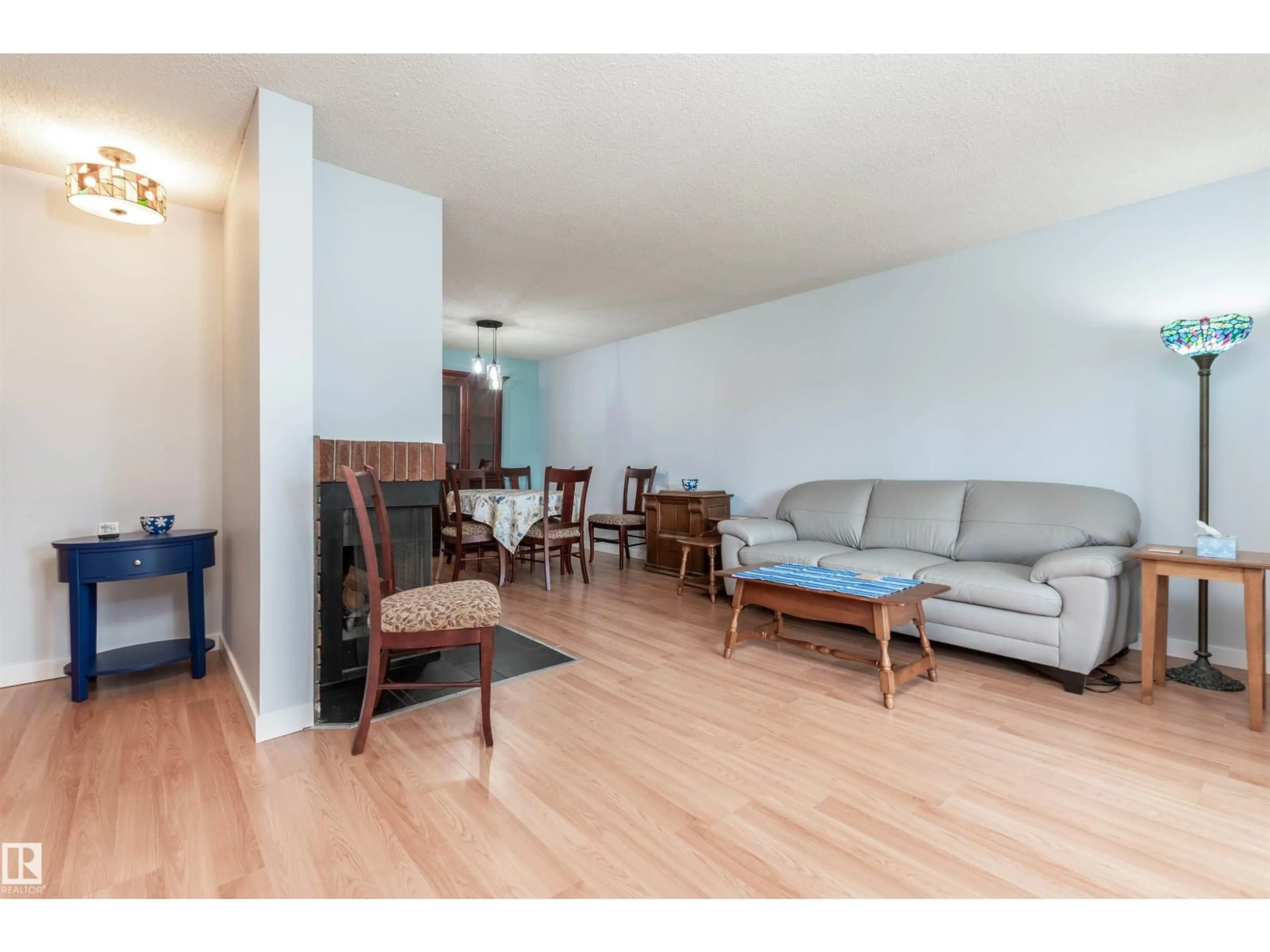 Living room with furniture, wood/laminate floor for 2109 SADDLEBACK RD, Edmonton Alberta T6J4T4