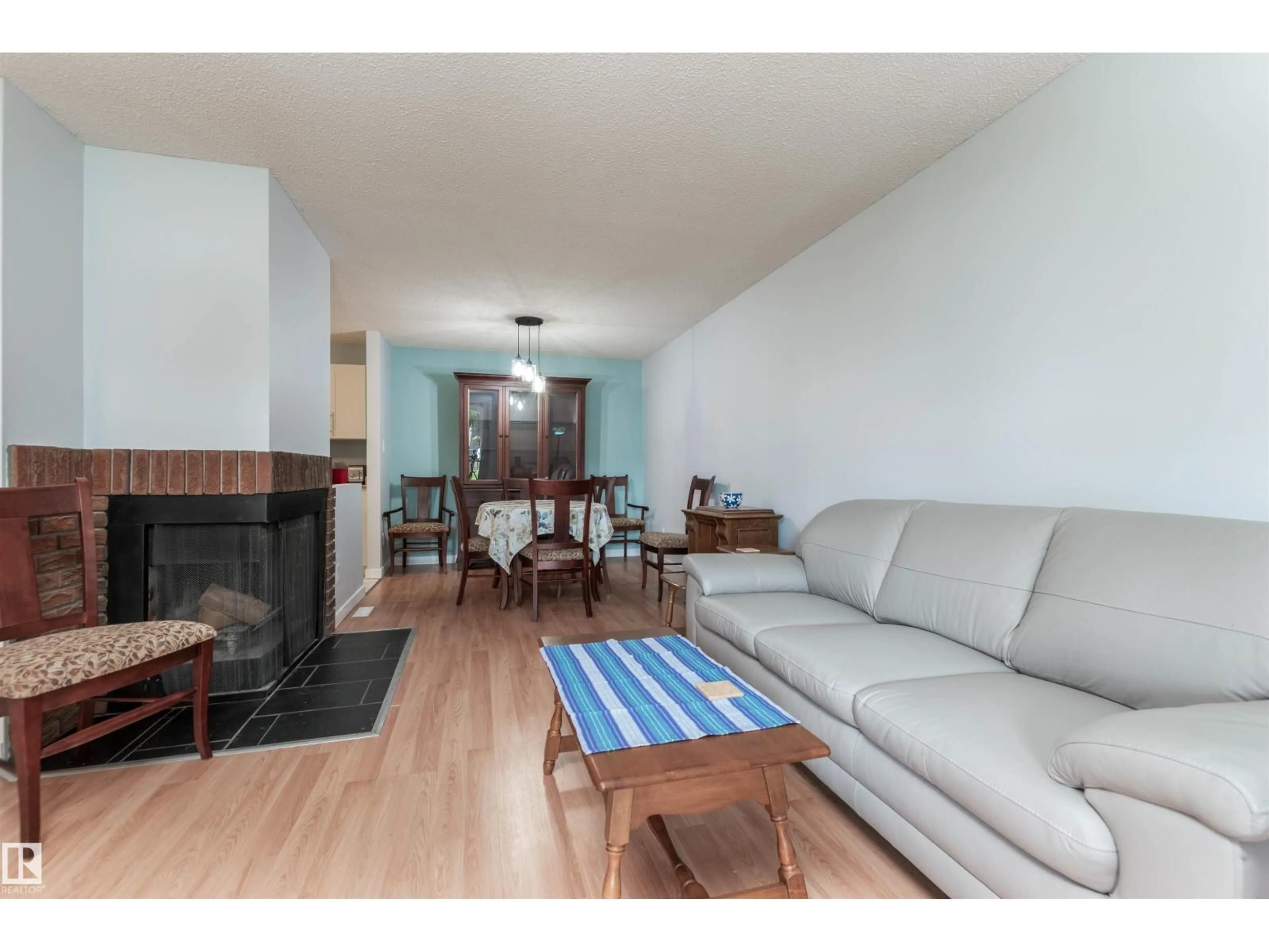 Living room with furniture, wood/laminate floor for 2109 SADDLEBACK RD, Edmonton Alberta T6J4T4