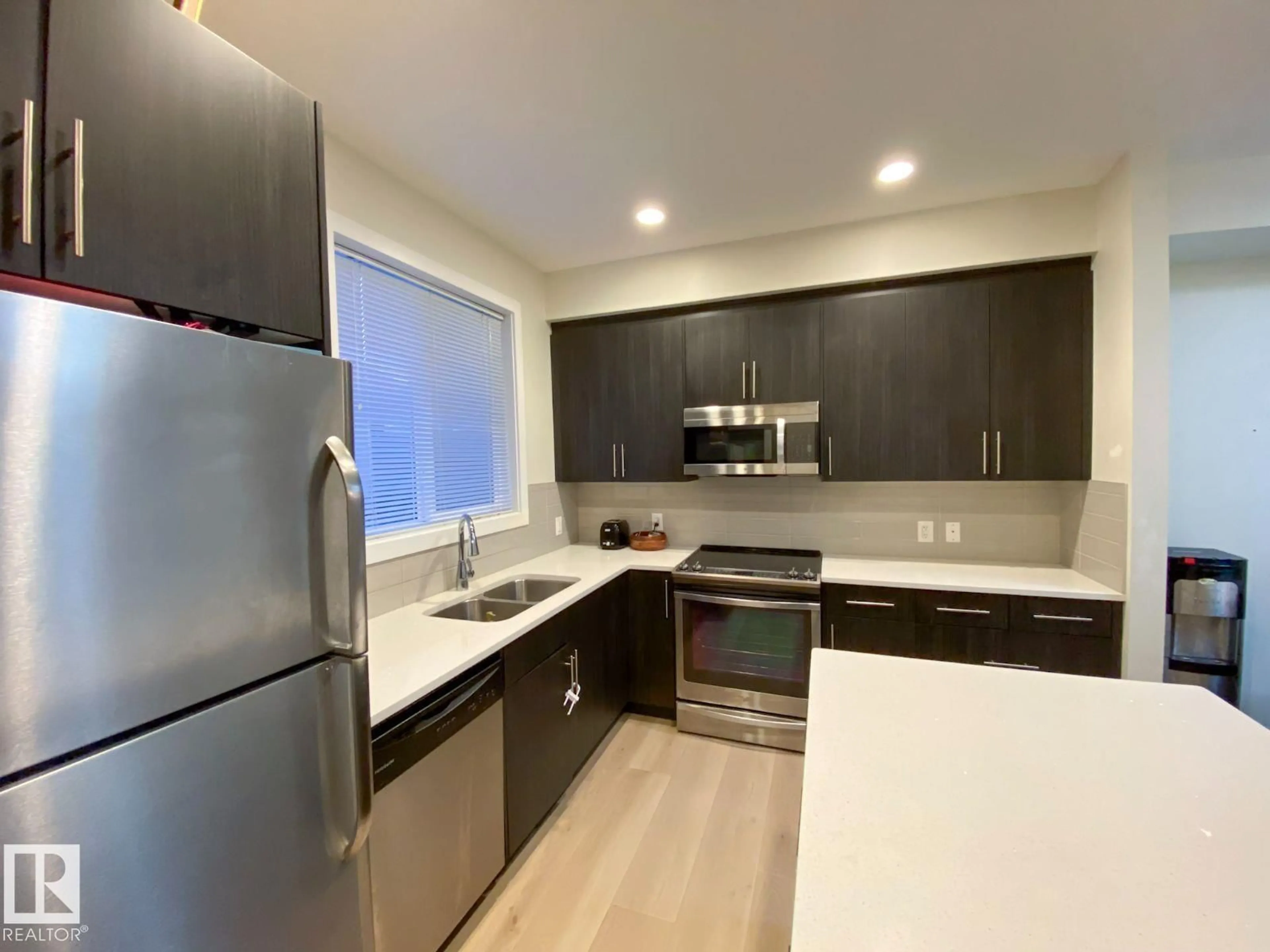 Open concept kitchen, unknown for 655 - 118 WATT BV, Edmonton Alberta T6X0Y2