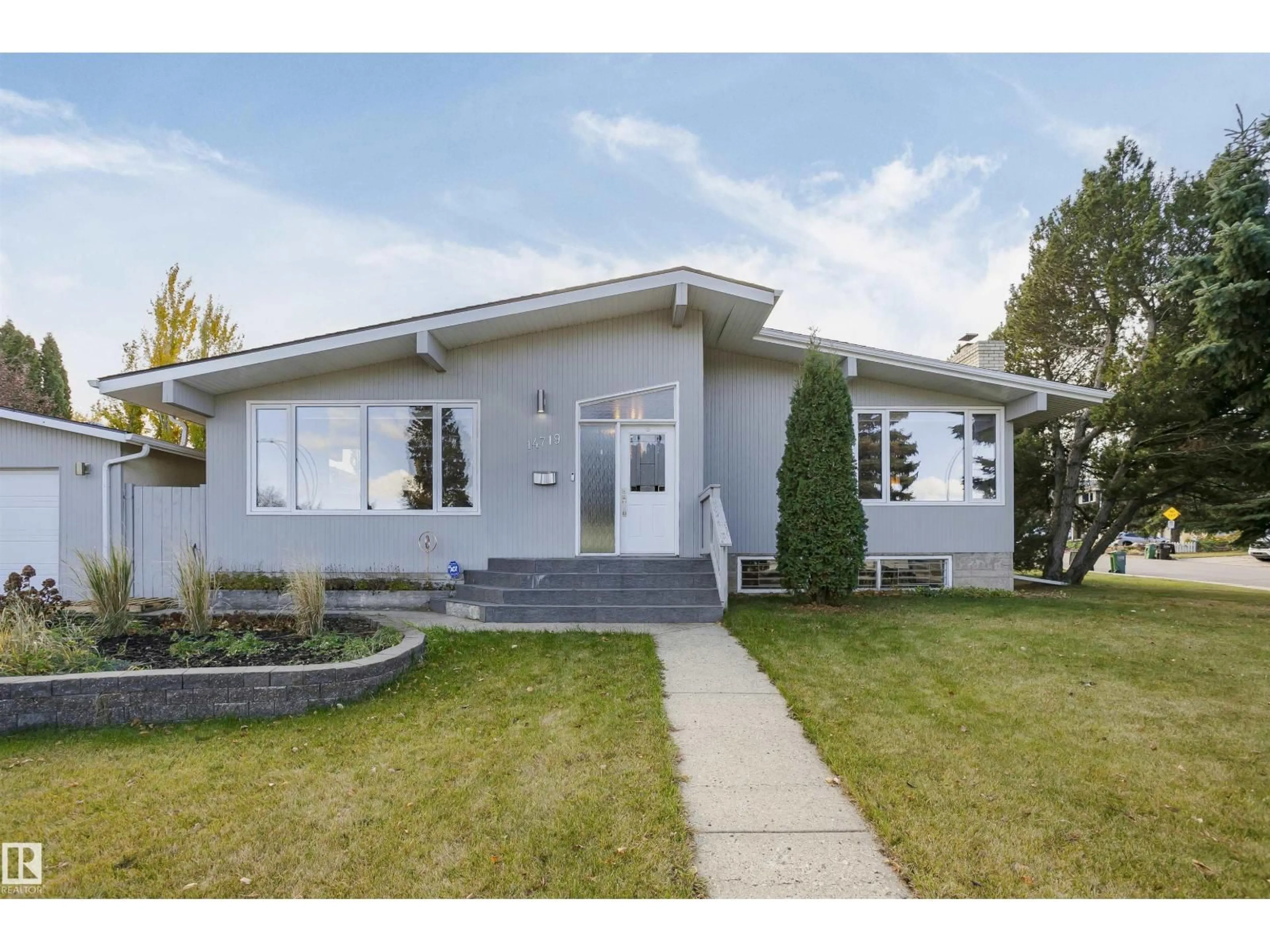 Home with vinyl exterior material, street for 14719 59 AV, Edmonton Alberta T6H4T5