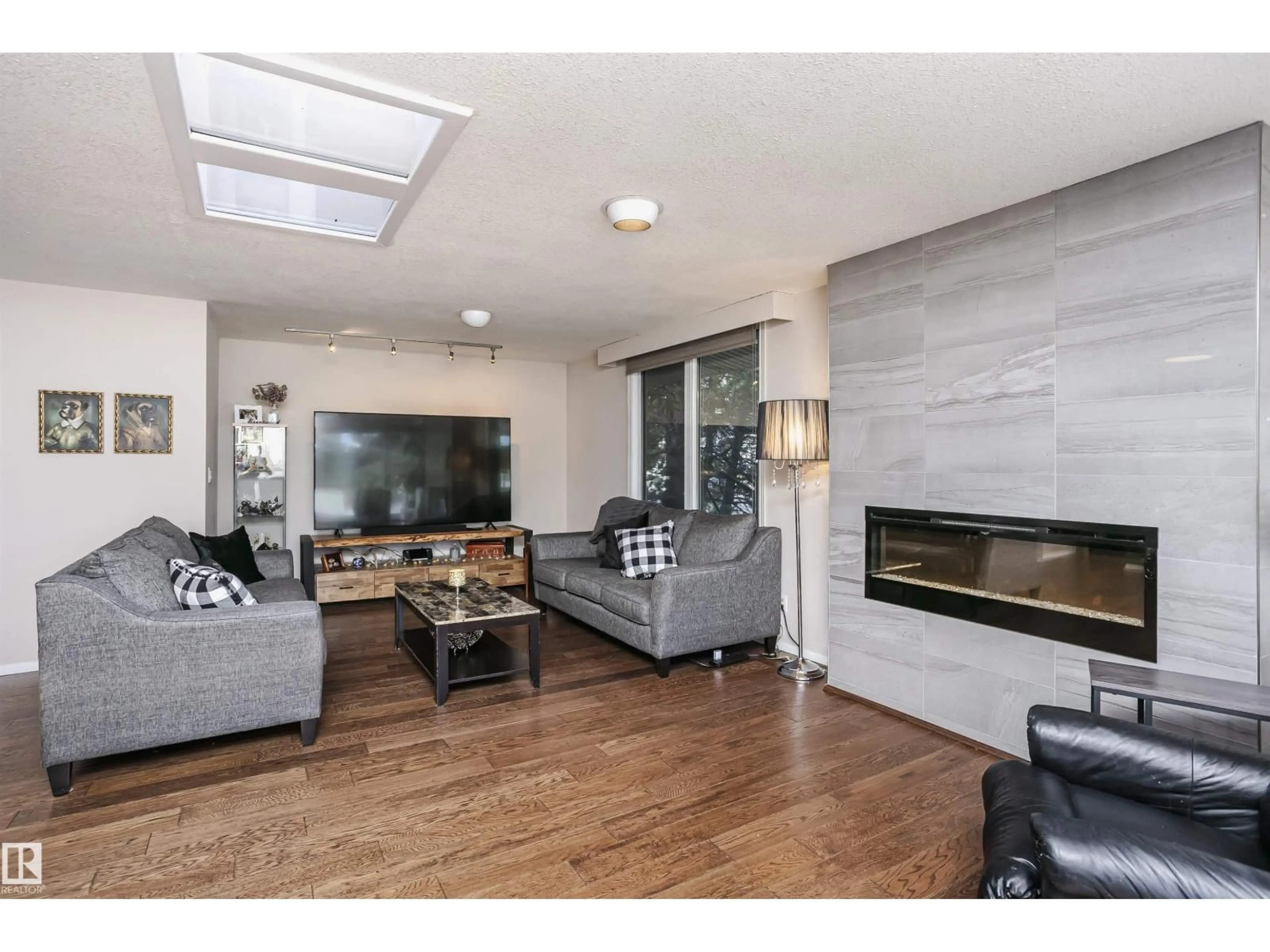 Living room with furniture, unknown for 14719 59 AV, Edmonton Alberta T6H4T5