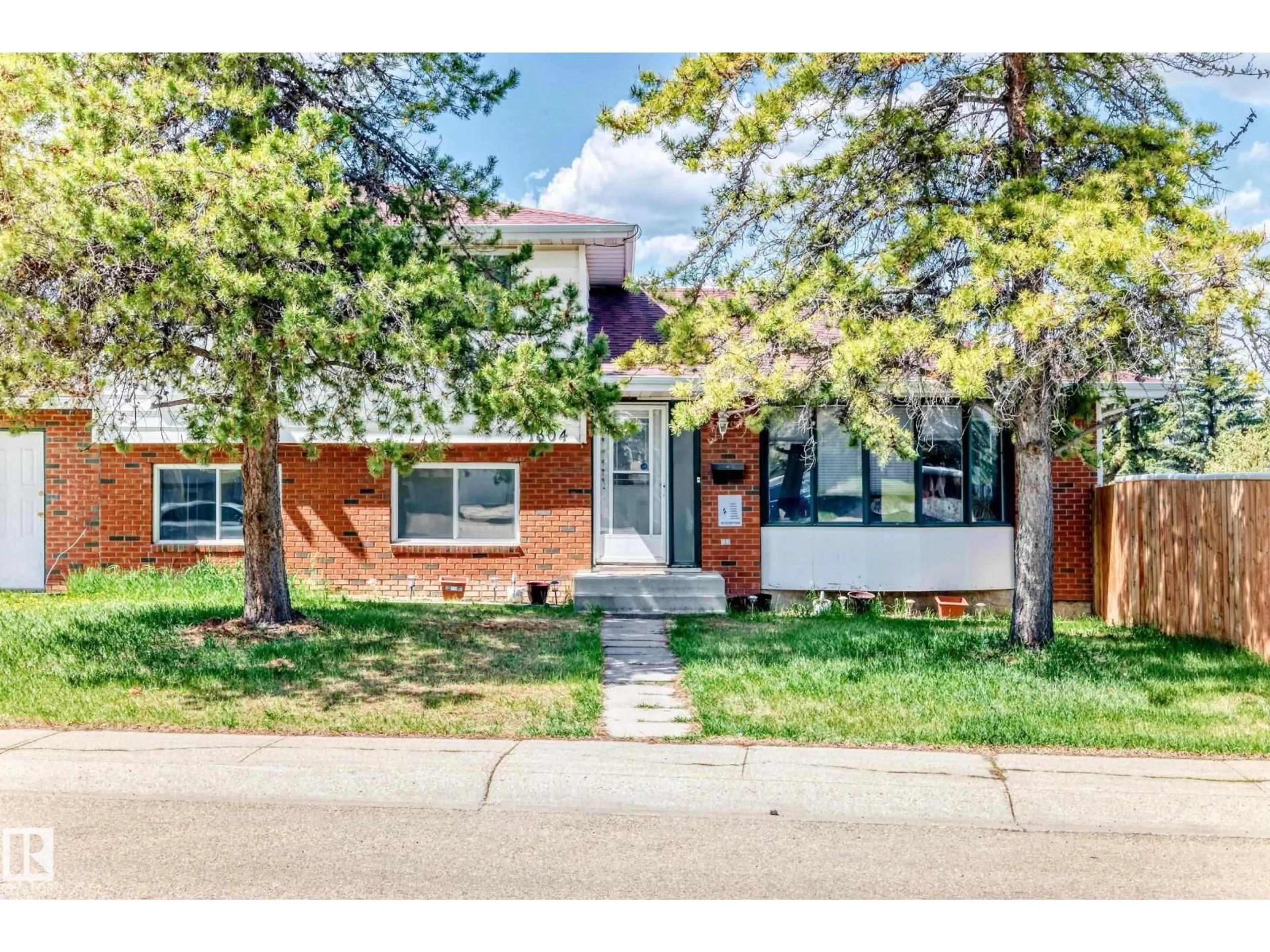 Home with brick exterior material, street for NW - 1804 51 ST, Edmonton Alberta T6L1K1
