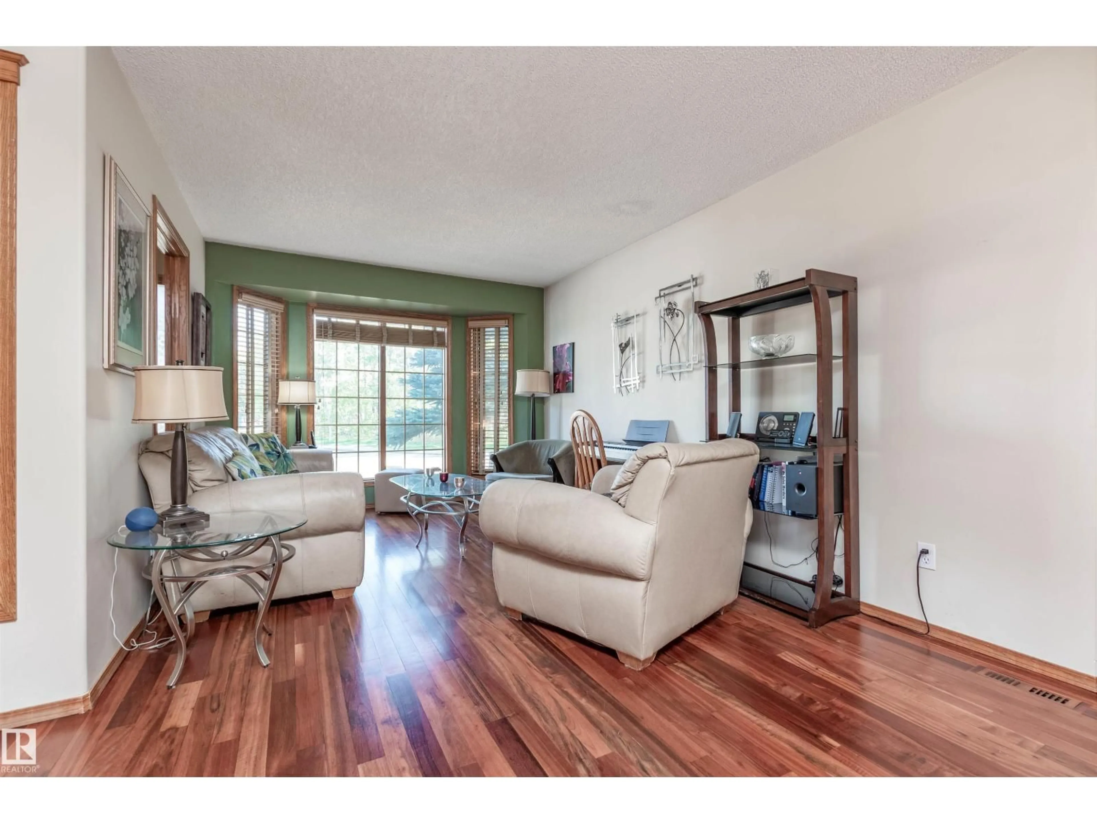Living room with furniture, wood/laminate floor for NW - 5204 190 ST, Edmonton Alberta T6M2L2