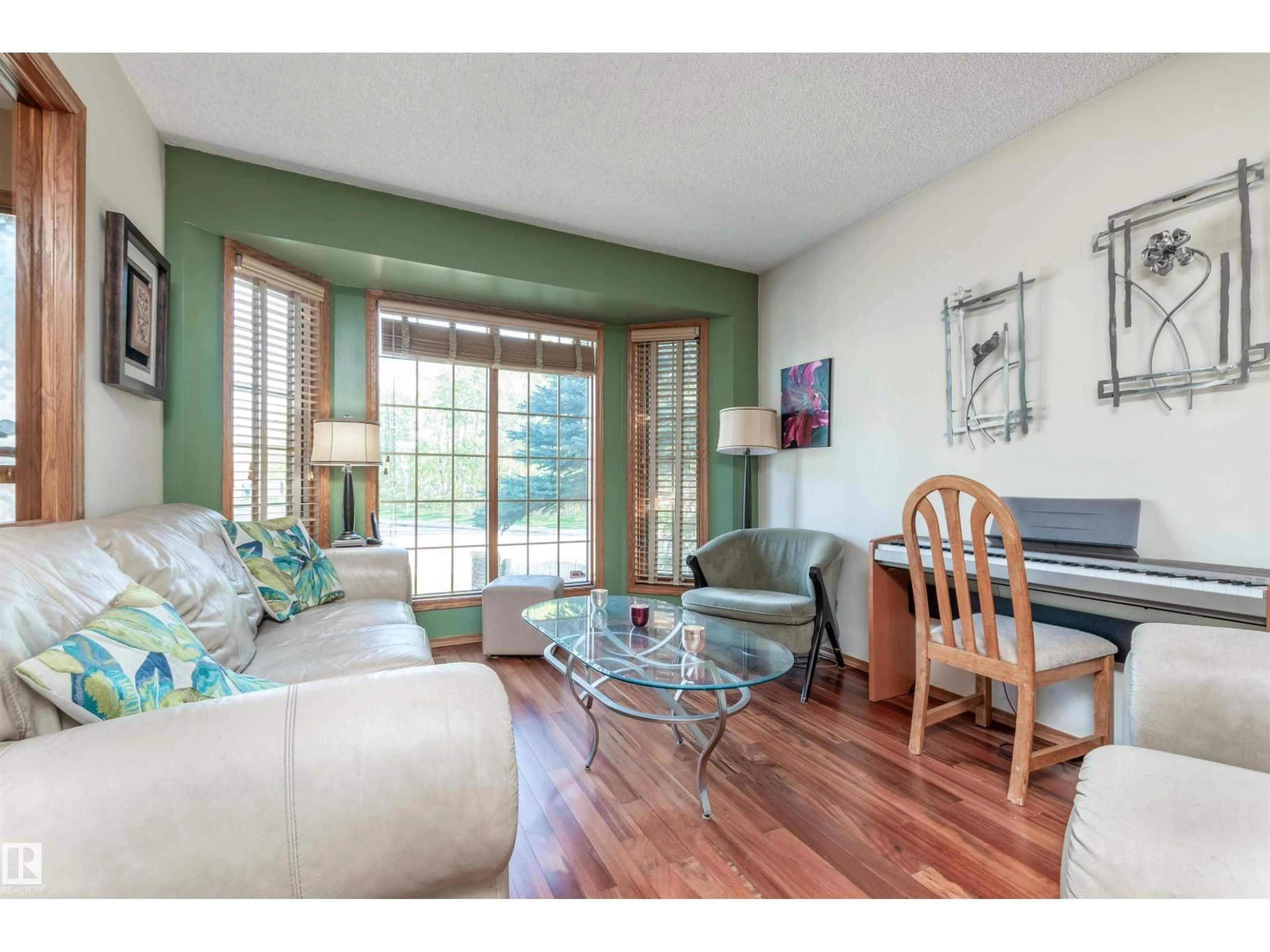 Living room with furniture, wood/laminate floor for NW - 5204 190 ST, Edmonton Alberta T6M2L2